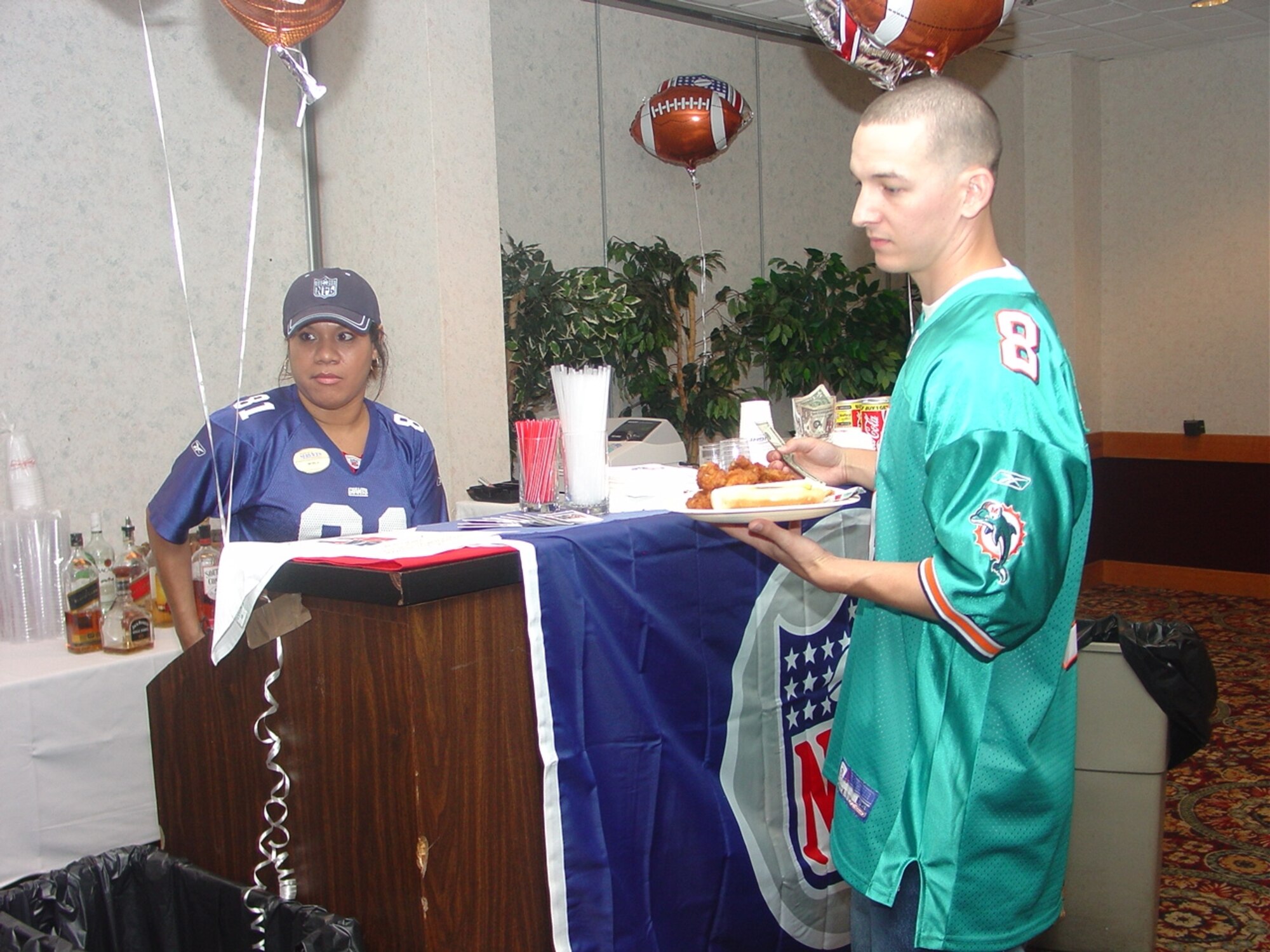 Hundreds of Team McGuire members participate in the kickoff of the NFL season at the McGuire Club. The USO and NFL provided food, football and prizes in appreciation for our military members.  