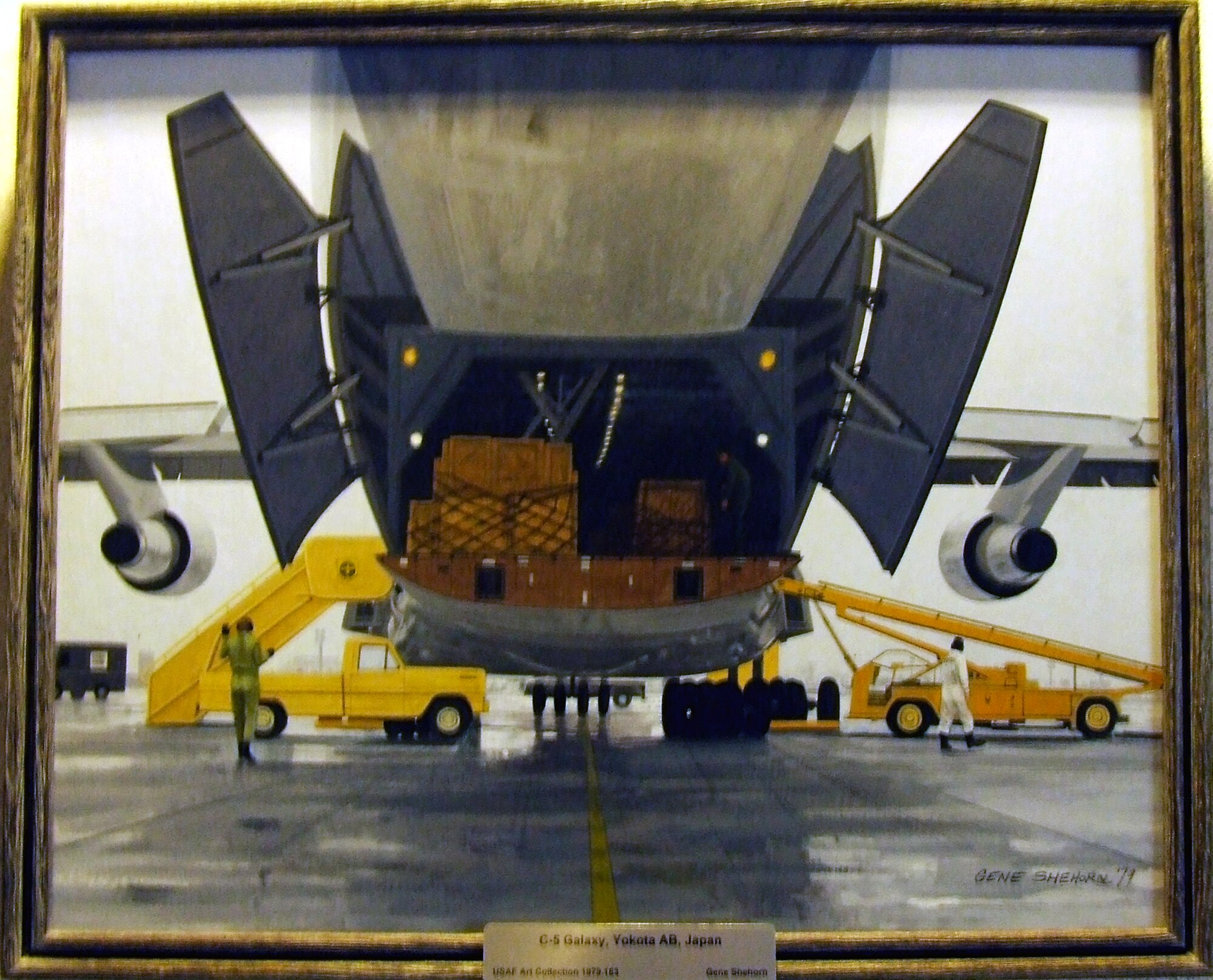 This 1979 painting by artist Gene Shehorn, entitled "C-5 Galaxy, Yokota Air Base, Japan," is one of numerous pieces from the Air Force Art Program on display in the U.S. Air Force Expeditionary Center on Fort Dix, N.J.  (U.S. Air Force Photo/Tech. Sgt. Scott T. Sturkol)