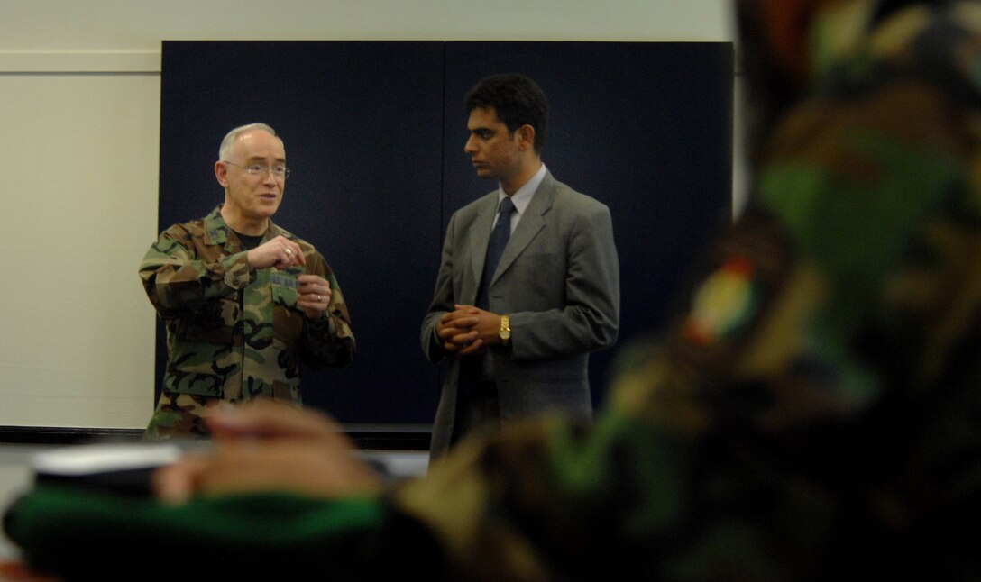 Chaplain (Col.) Bobby Page, command chaplain for Air Combat Command, speaks to distinguished Afghan troops at the Langley Chapel Sept. 5. Mr. Noorullah Akbari was the translator throughout their visit. Colonel Page spoke about the different religions and the importance of chaplains in the military. Their visit was part of a week-and-a-half tour for the Strategic Leadership Planning Conference, which hosts religious leaders from overseas. (U.S. Air Force photo/Senior Airman Cecil C. McCloud)