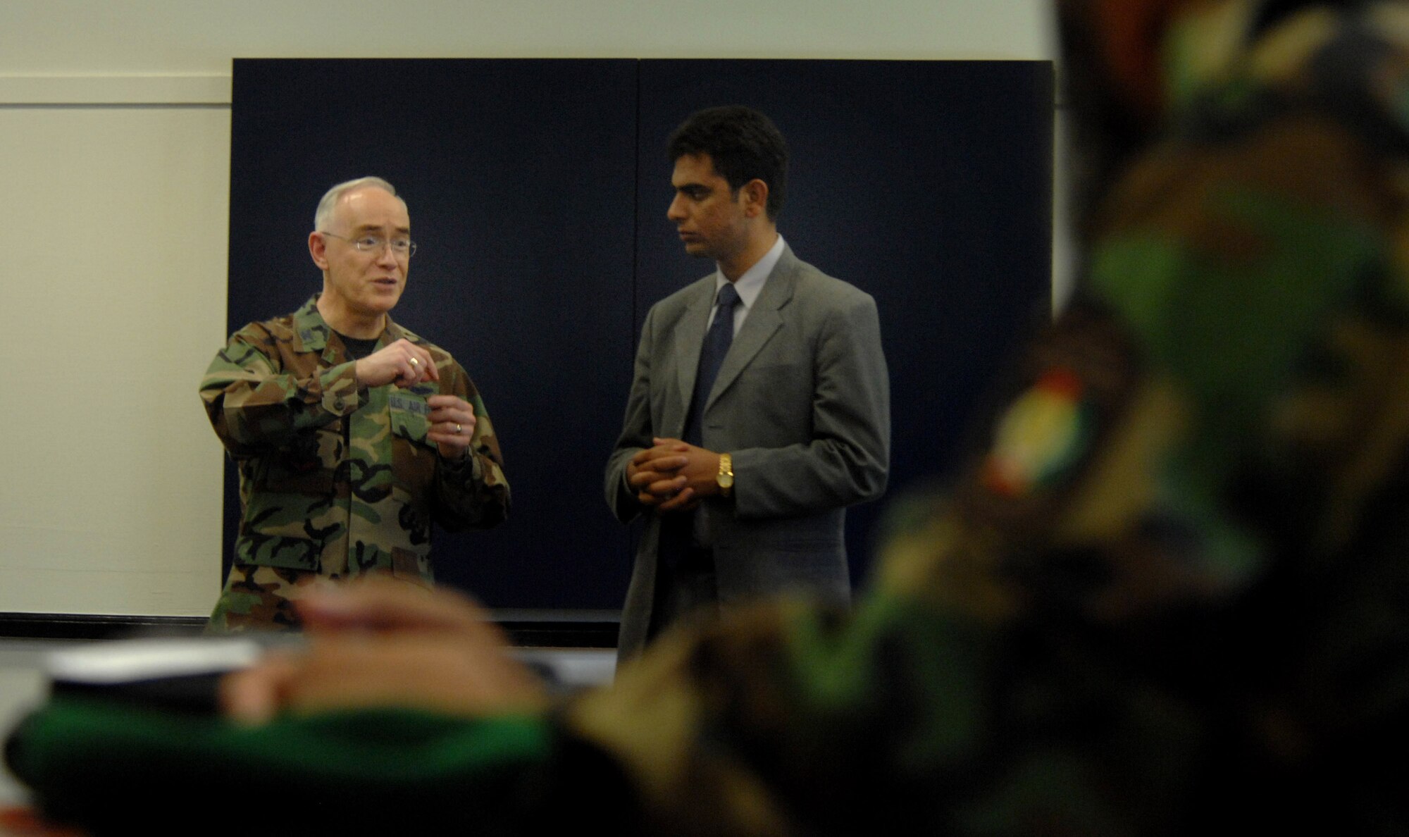 Chaplain (Col.) Bobby Page, command chaplain for Air Combat Command, speaks to distinguished Afghan troops at the Langley Chapel Sept. 5. Mr. Noorullah Akbari was the translator throughout their visit. Colonel Page spoke about the different religions and the importance of chaplains in the military. Their visit was part of a week-and-a-half tour for the Strategic Leadership Planning Conference, which hosts religious leaders from overseas. (U.S. Air Force photo/Senior Airman Cecil C. McCloud)