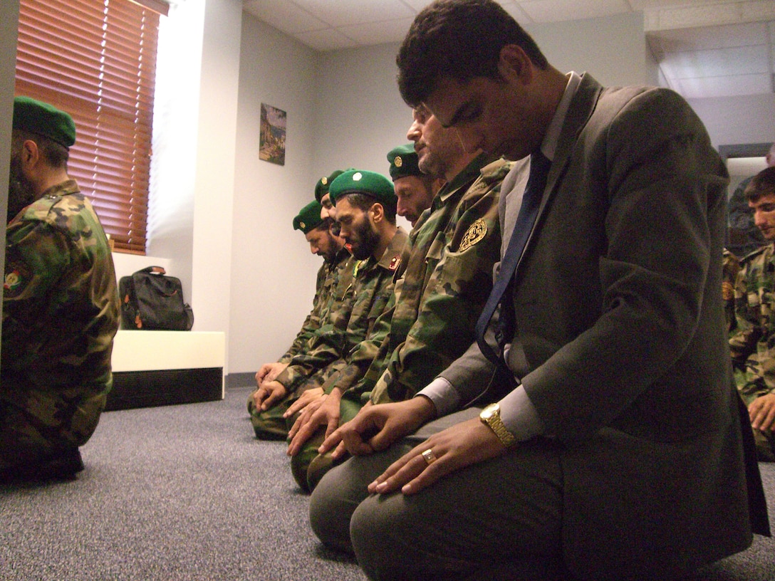 Senior leaders from Afghanistan's Religious Cultural Affairs took a moment for prayer during their visit to Langley Sept. 5. Their visit was part of a week-and-a-half tour for the Strategic Leadership Planning Conference, which hosts religious leaders from overseas. (U.S. Air Force photo/Airman 1st Class Chase S. DeMayo)
