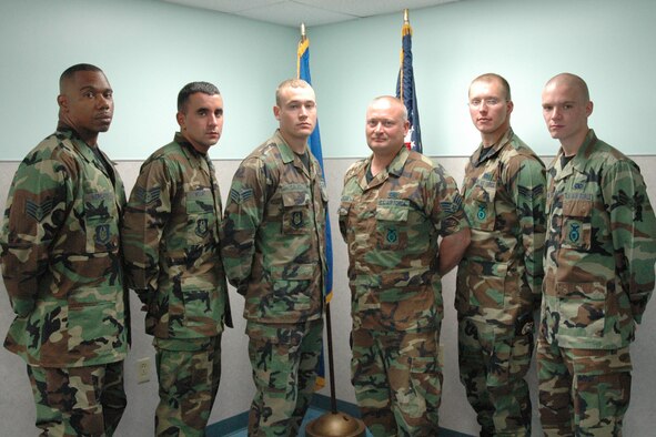 YOUNGSTOWN AIR RESERVE STATION; Ohio - Six members of the 910th Security Forces Squadron returned here after a half year deployment to Kirkuk Regional Air Base, Iraq. The Air Force Reserve personnel performed force protection duties and other related security functions during their overseas mission. Pictured left to right are: Staff Sgt. Miguel A. Mercado, Staff Sgt. Loren M. Mount, Staff Sgt. Brian E. Cales, Staff Sgt. Edward McLean, Senior Airman Matthew R. Leske and Senior Airman Jared Thompson. U.S. Air Force photo by Tech. Sgt. Bob Barko Jr.