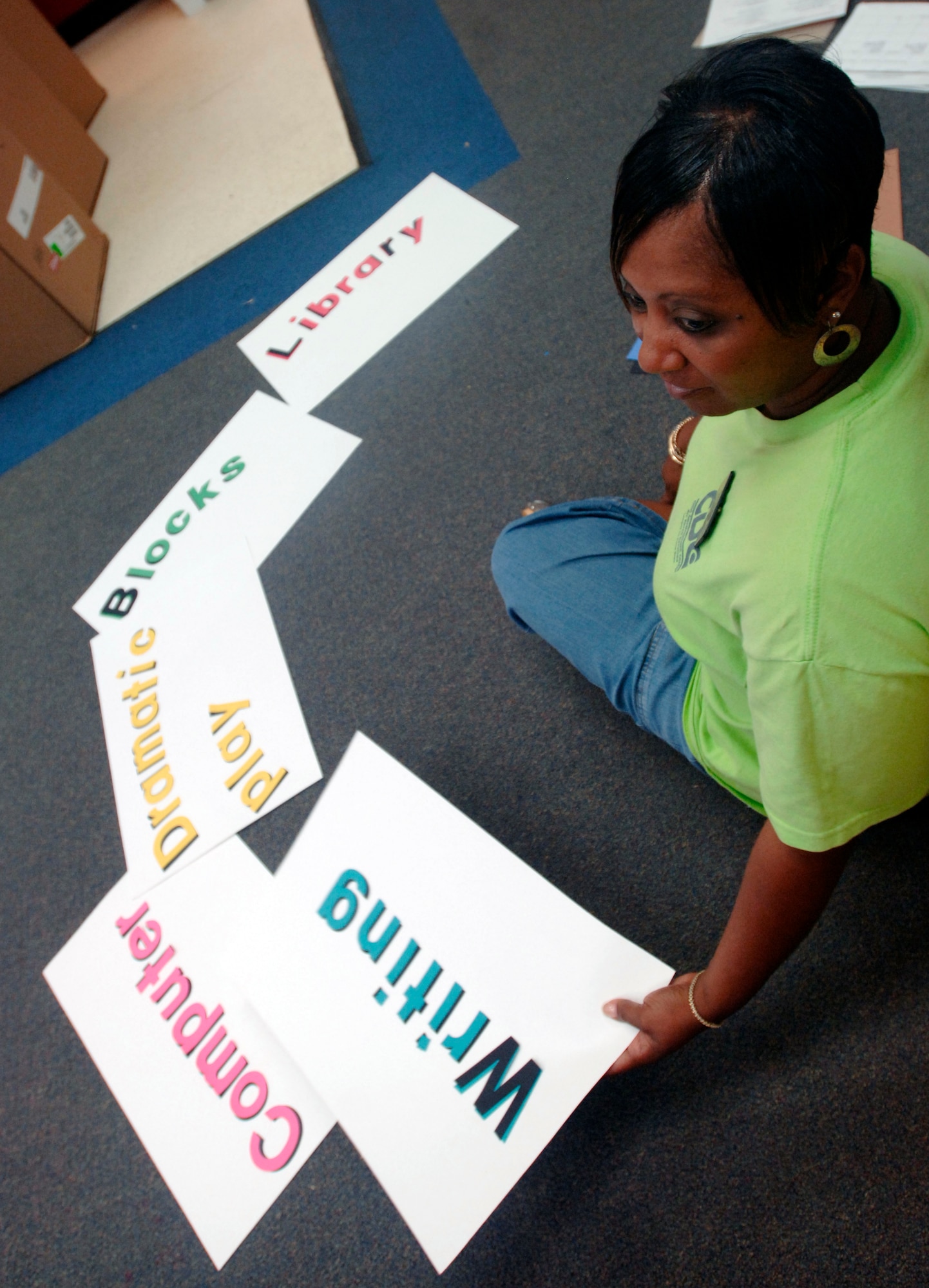 Annette Solomon, Russ Child Development Center program assistant, prepares classroom materials Aug. 30 for her incoming class of 18 4-year-olds. Ms. Solomon’s class, which begins Sept. 4, is part of the Start Strong Initiative, a statewide pilot program that teams Virginia communities with private, faith-based, home-based and military providers in an effort to provide quality preschool education. (U.S. Air Force photo/Airman 1st Class Vernon Young)
