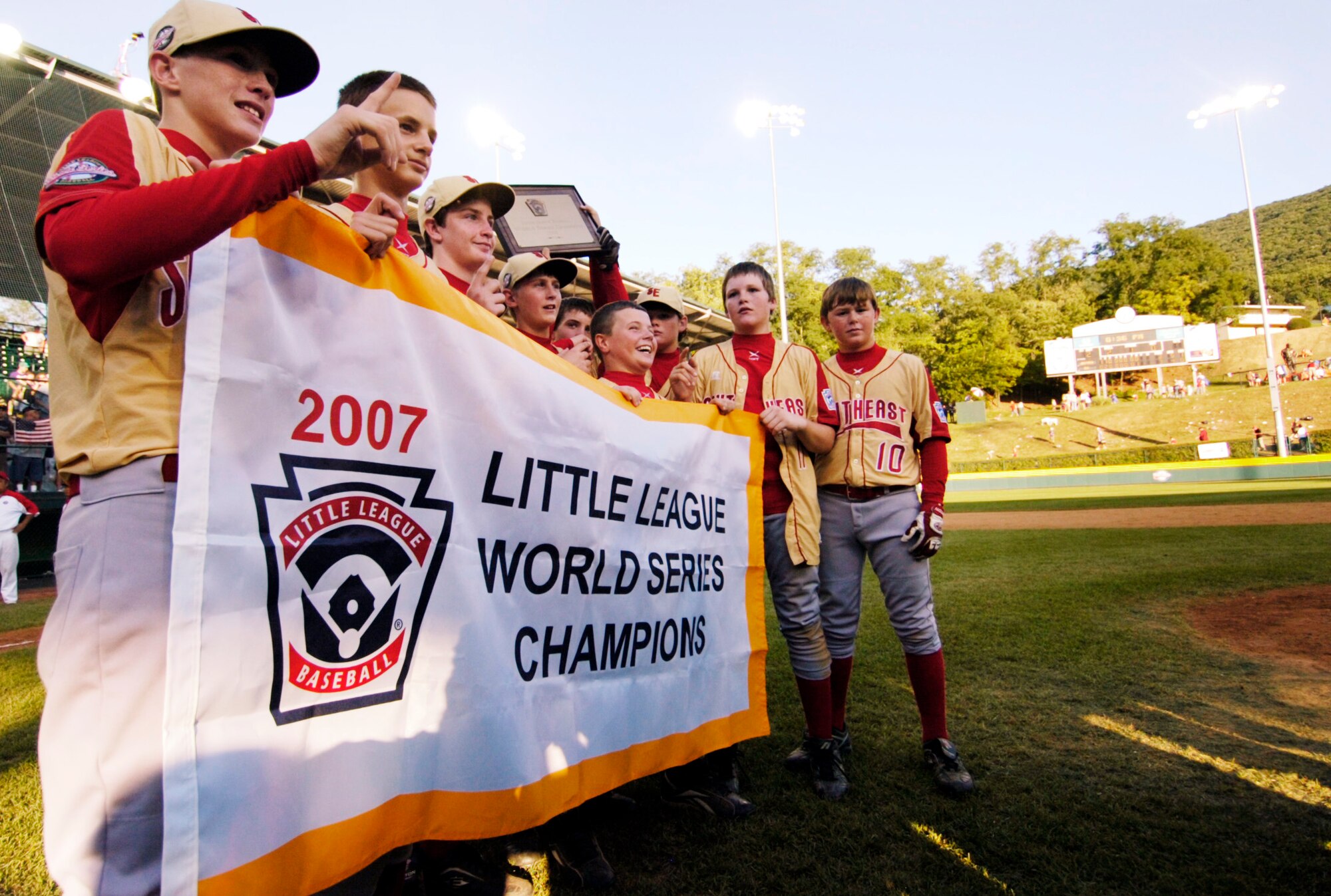 Players on the Warner Robins American Little League team hold up their Little League World Series Championship flag after their 3-2 win over Japan Aug. 26. (U.S. Air Force photo by Jason Vorhees)