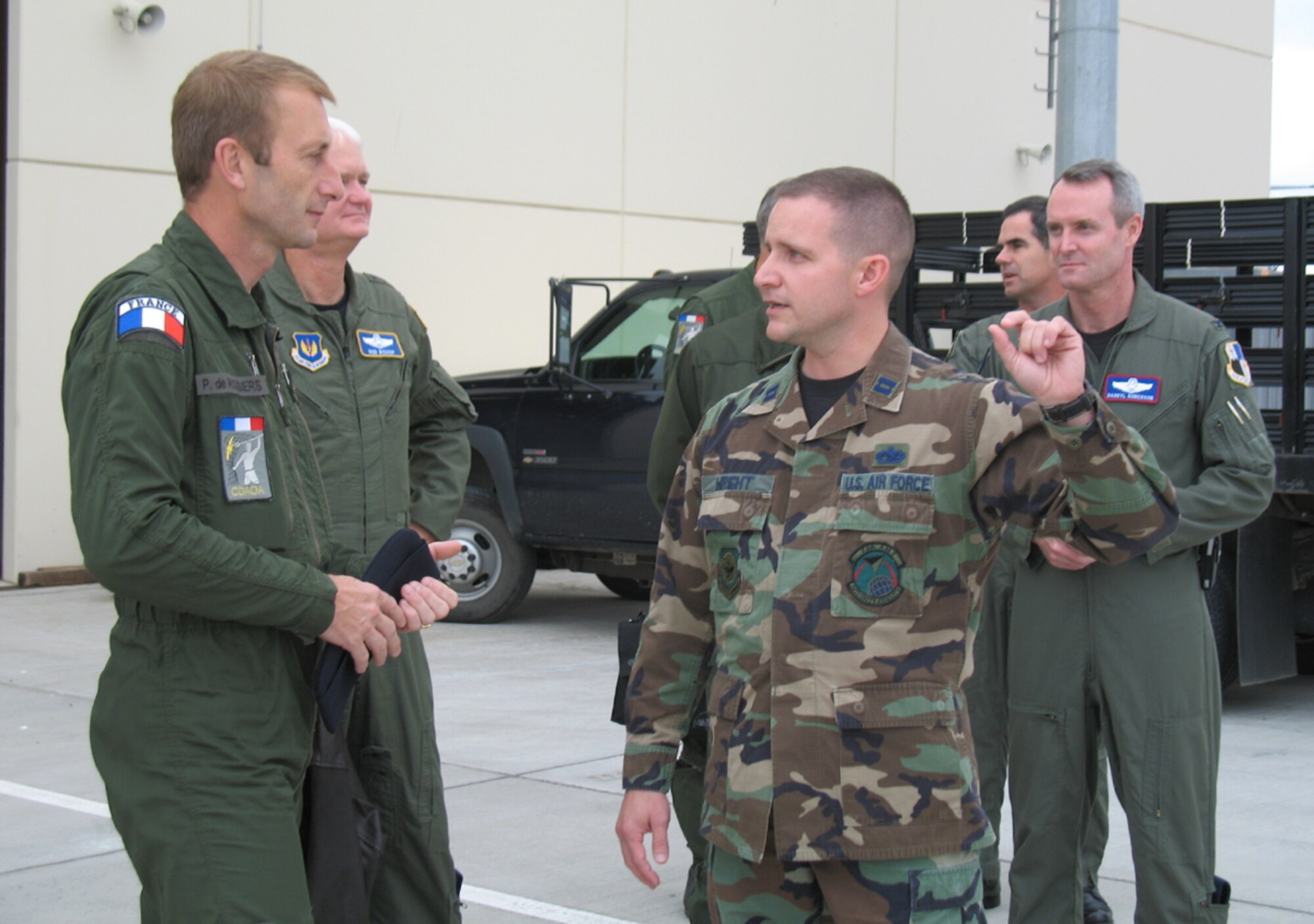 SPANGDAHLEM AB, Germany – Capt. Timothy Wright, 726th Air Mobility Squadron, discusses his squadron’s mission with Lt. Gen. Patrick de Rousiers, French air force air defense and operations command, during the general’s visit to Spangdahlem AB Sept. 6.
Lt. Gen. Robert Bishop, 3rd Air Force commander, (left) and Col. Darryl Roberson, 52nd Fighter Wing commander, (right) escorted the general, along with Brig. Gen. Jean-Marc Vansantberghe, French senior representative. (U.S. Air Force photo/Tech. Sgt. Margie Quicanopalacios)
