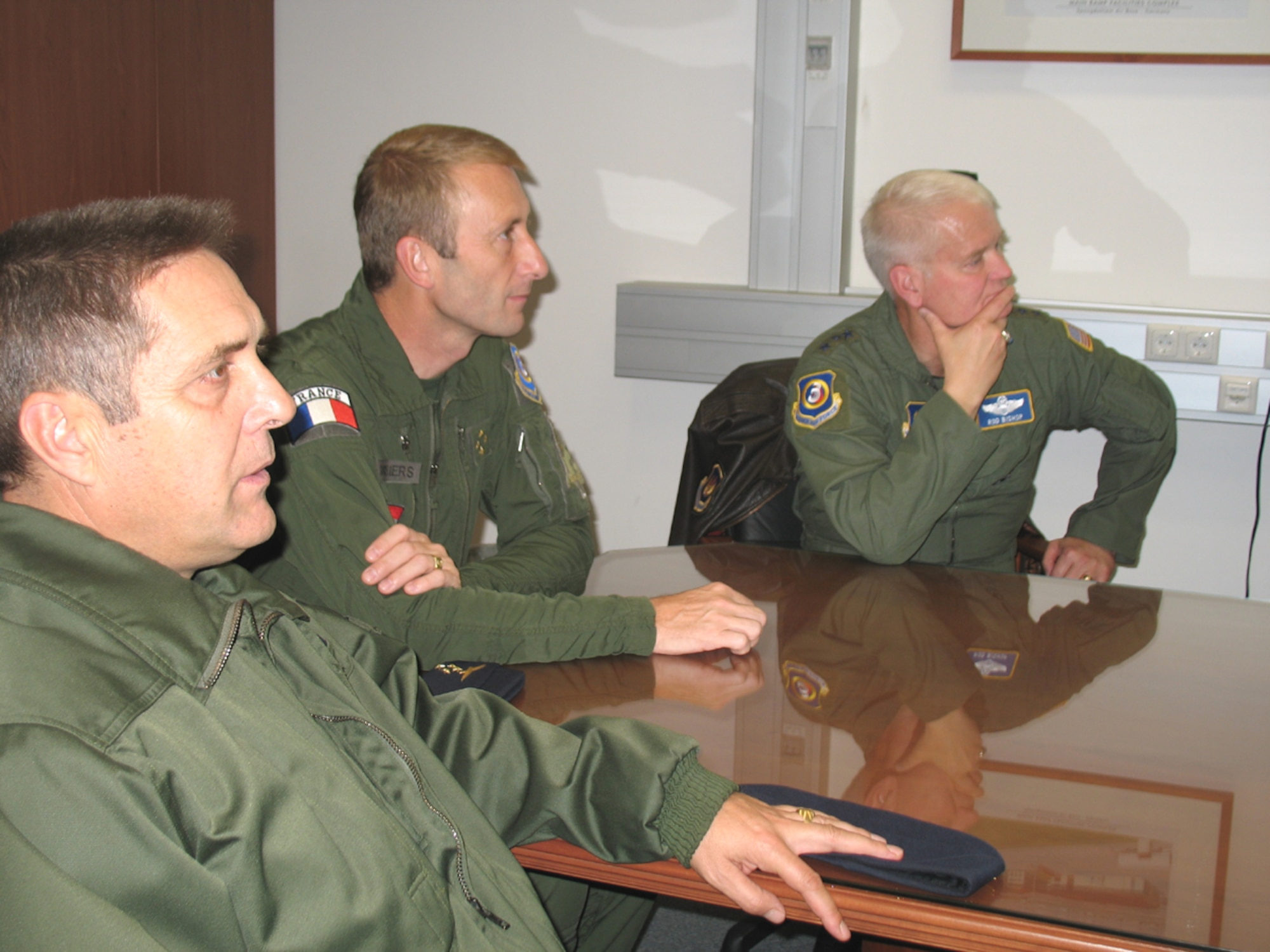 SPANGDAHLEM AB, Germany – From left: Brig. Gen. Jean-Marc Vansantberghe, French senior representative, Lt. Gen. Patrick de Rousiers, French air force air defense and operations command, and Lt. Gen. Robert Bishop, 3rd Air Force commander, attend a mission briefing at the 726th Air Mobility Squadron here during the French generals’ visit to Spangdahlem AB Sept. 6. The purpose of the general’s visit was Third Air Force orientation and open discussion on interoperability and bolster NATO partnership. (U.S. Air Force photo/Tech. Sgt. Margie Quicanopalacios)
