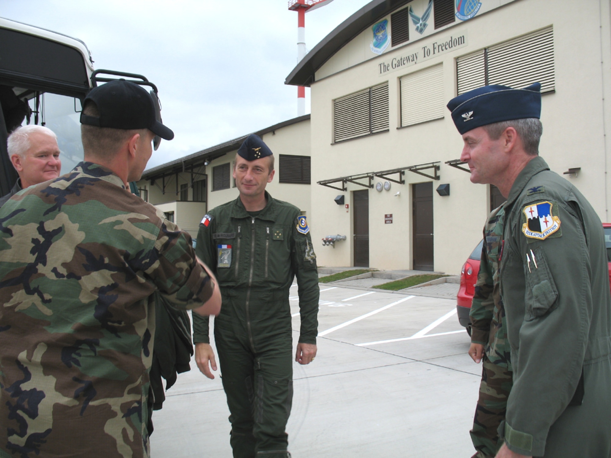 SPANGDAHLEM AB, Germany – Lt. Gen. Patrick de Rousiers, French air force air defense and operations command, is greeted by Lt. Col. Trevor Nitz, 726th Air Mobility Squadron commander, (left) during his visit to Spangdahlem AB’s passenger terminal Sept. 6. The purpose of the general’s visit was Third Air Force orientation and open discussion on interoperability and bolster NATO partnership. Lt. Gen. Robert Bishop, 3rd Air Force commander, (left) and Col. Darryl Roberson, 52nd Fighter Wing commander, escorted the general, along with Brig. Gen. Jean-Marc Vansantberghe, French senior representative. (U.S. Air Force photo/Tech. Sgt. Margie Quicanopalacios)