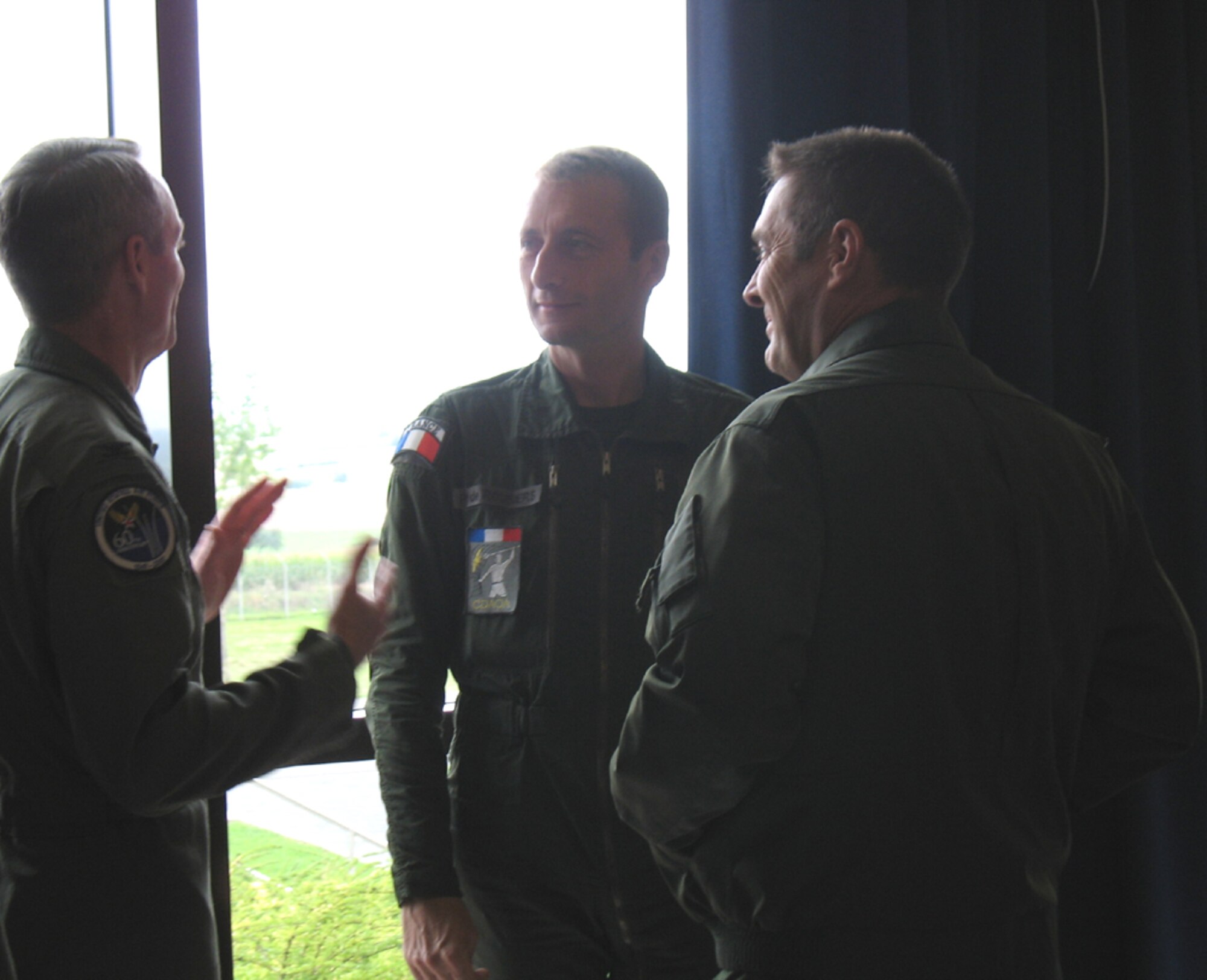 SPANGDAHLEM AB, Germany – Col. Darryl Roberson, 52nd Fighter Wing commander, (left) talks with Lt. Gen. Patrick de Rousiers, French air force air defense and operations command, (center) and Brig. Gen. Jean-Marc Vansantberghe, French senior representative, at Spangdahlem AB’s Club Eifel during the generals' visit here Sept. 6. The purpose of the general’s visit was Third Air Force orientation and open discussion on interoperability and bolster NATO partnership. Lt. Gen. Robert Bishop, 3rd Air Force commander, was also in attendance. (U.S. Air Force photo/Tech. Sgt. Margie Quicanopalacios)