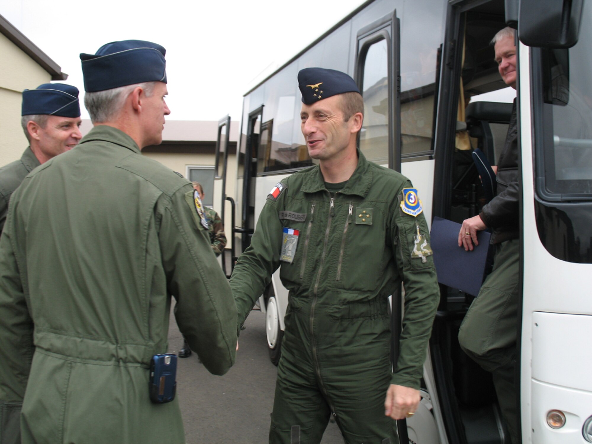 SPANGDAHLEM AB, Germany – Lt. Gen. Patrick de Rousiers, French air force air defense and operations command, is greeted by Col. Thomas Lawhead, 52nd Operations Group commander, during his visit to Spangdahlem AB’s Saber Control Sept. 6. The purpose of the general’s visit was Third Air Force orientation and open discussion on interoperability and bolster NATO partnership. Lt. Gen. Robert Bishop, 3rd Air Force commander, (far right) and Col. Darryl Roberson, 52nd Fighter Wing commander, escorted the general and Brig. Gen. Jean-Marc Vansantberghe, French senior representative. (U.S. Air Force photo/Tech. Sgt. Margie Quicanopalacios)