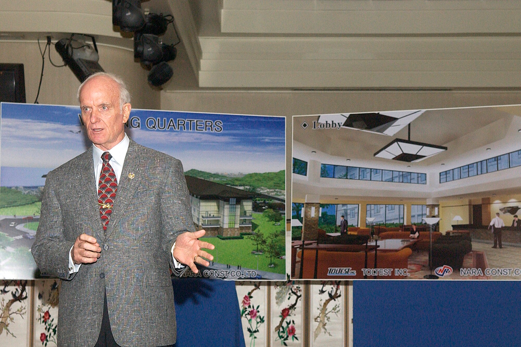 KUNSAN AIR BASE, South Korea -- Mr. Arthur J. Myers, Air Force Services director, explains how the base's new lodging facility, currently under construction, will eliminate Kunsan's current, substandard visiting quarters during a groundbreaking ceremony Sept. 7 here. The new facility, scheduled to open in July 2009, aims to "improve base morale by enhancing the quality of life for visiting Airmen," according to Col. CQ "Wolf" Brown, 8th Fighter Wing commander. Mr. Myers is visiting from the Pentagon. (U.S. Air Force photo/Senior Airman Giang Nguyen)                               
