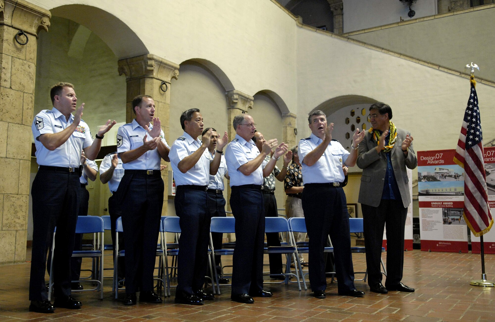 Air Force members and Mayor Mufi Hannemann sing the Air Force song after proclaiming Air Force Week Honolulu Sept. 9 at the Honolulu Hale in Hawaii. Mr. Hannemann, mayor for the city and county of Honolulu, Hawaii proclaimed Sept. 7 through 15 as Air Force Week in Honolulu. (U.S. Air Force photo/Tech. Sgt. Shane A. Cuomo)