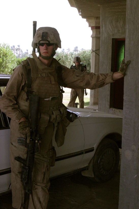 Marines with Company K, 3rd Battalion, 3rd Marine Regiment, Regimental Combat Team 6, stationed at Camp Fallujah, patrol through a small village north of Karmah, Iraq, Sept. 10. Kilo Co. started operations in the previously-untouched territories that are known for insurgent activities and hope to push the insurgents out of the area or trap them in to be captured.