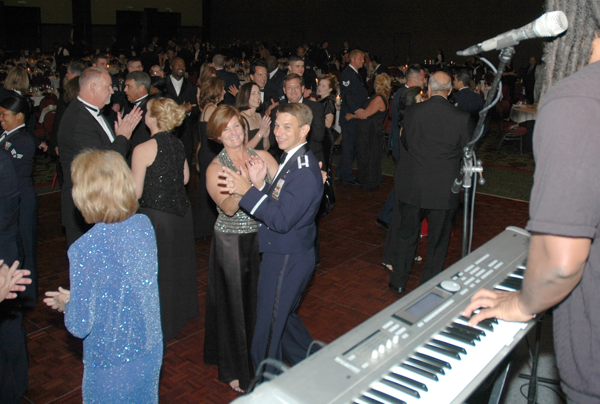 Col. Mark Bauknight, 315th Airlift Wing vice commander and his wife Leslie enjoy themselves on the dance floor at the 2007 Air Force Ball.  The 2007 Air Force Ball at Charleston AFB, S.C. celebrated the 60th anniversary of the Air Force and was attended by over 1,000 people.  (Photo by Capt. Wayne Capps, USAFR)