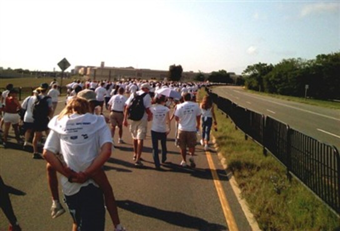 Participants of the 2007 Freedom Walk approach the Pentagon where they will listen to a concert by the Harlem Gospel Choir, Sept. 9, 2007. 