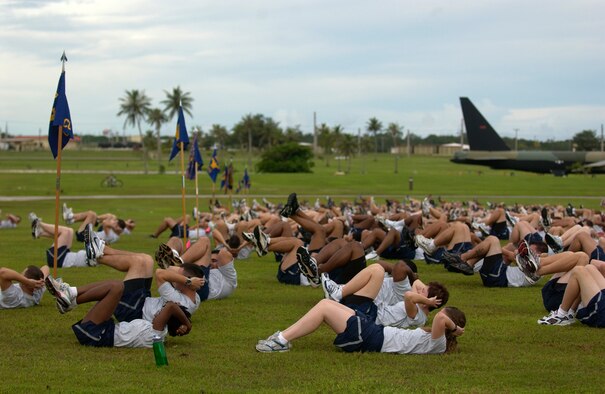 ANDERSEN AIR FORCE BASE, Guam – Andersen Airmen do crunches at Arc Light Park prior to participating in the Wing Run Sept. 7. Andersen has a monthly Wing Run to emphasize physical training and to promote esprit de corps. (Photo by Tech. Sgt. Michael Boquette)