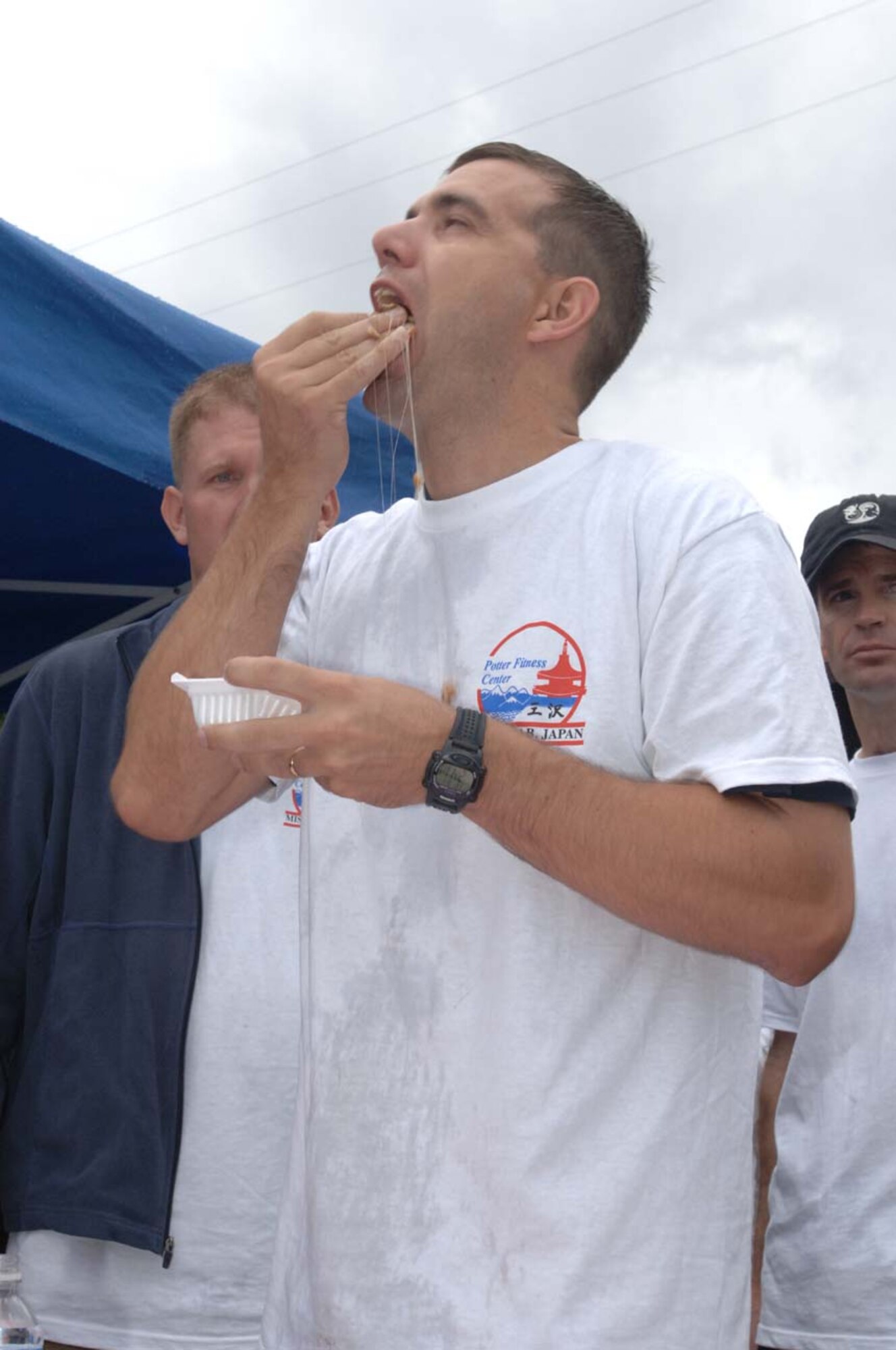 MISAWA AIR BASE, Japan -- Maj. Roy Rockwell, 35 Fight Wing staff team, samples some Japanese appetizers during the taste of Japan challenge during the base's first Survivor Challenge here August 31, 2007. Fourteen teams of 10 challengers were going for the first prize of $2,000. (U.S. Air Force photo by Tech. Sgt. Andy Bellamy)