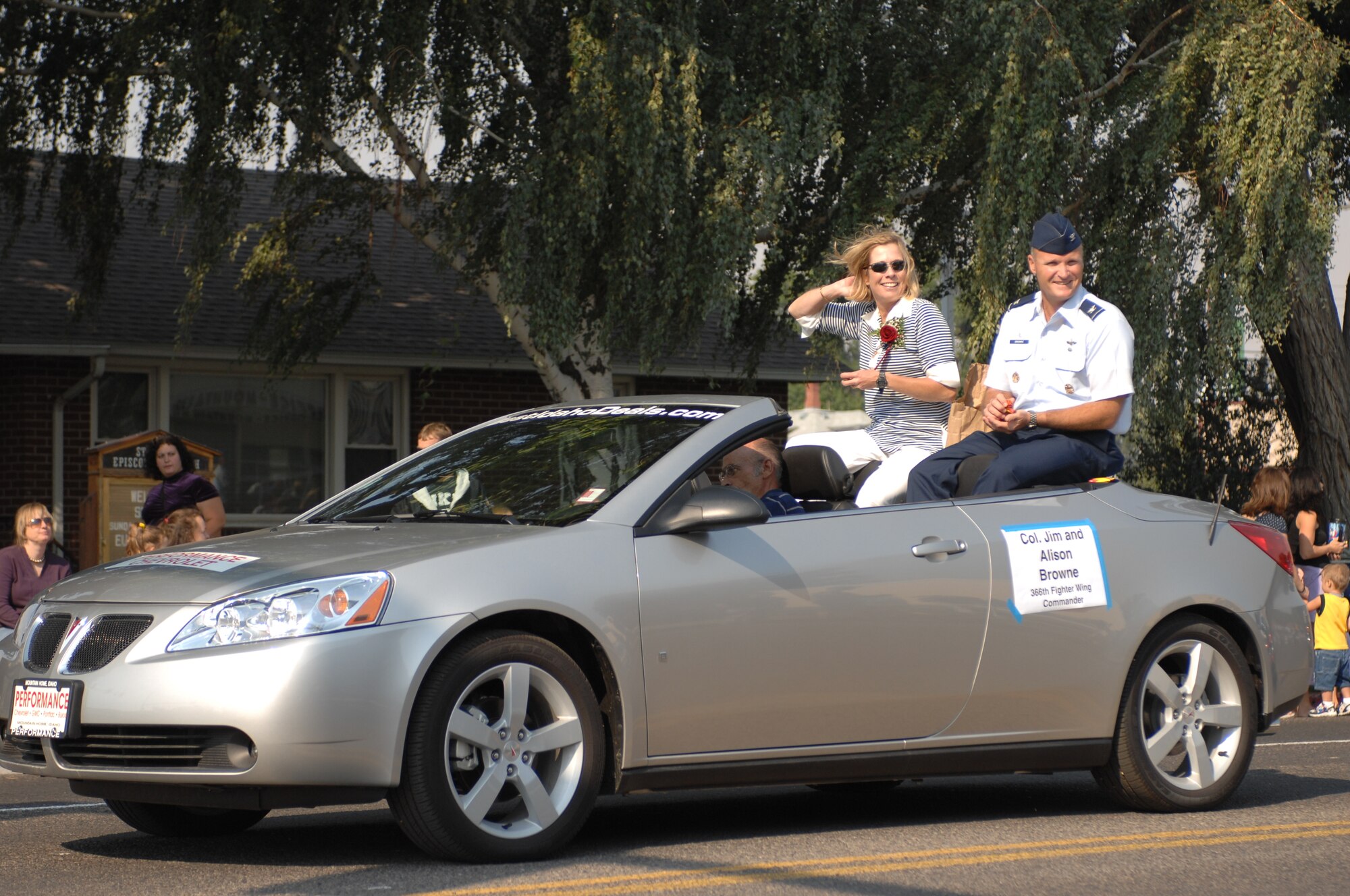 MOUNTAIN HOME AIR FORCE BASE, Idaho -- Col. and Mrs. James Browne, 366th Fighter Wing commander, wave to Gunfighters and members of the local community during the Air Force Appreciation Day parade in downtown Mountain Home Sept. 8. Participants honored the Air Force throughout the day beginning with the parade and ending with a booth fair at Carl Miller Park. With the Air Force’s anniversary on Sept. 18, Airmen here along with community members will celebrate again at the Air Force heritage day celebration Aug. 14. People can access the base through the Grandview entrance starting at noon with the celebration officially kicking off at 1:30 p.m. (U.S. Air Force photo/Airman 1st Class Ryan Crane)