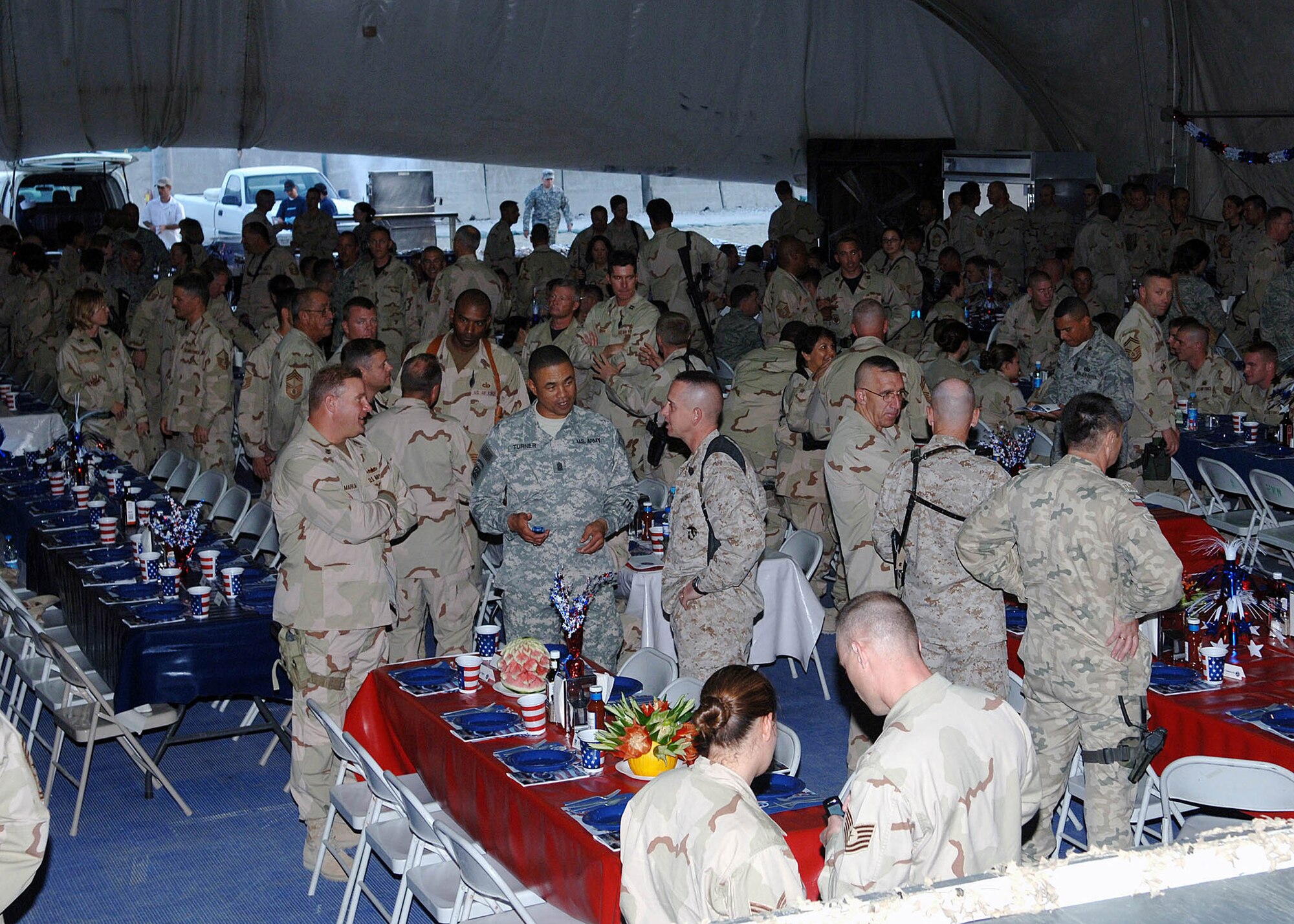 Soldiers, Sailors, Aimen and Marines were in attendance for the Air Force 60th Anniversary Ball held Sept. 8 at Bagram Air Base, Afghanistan. The multiservice crowd had dinner and watched videos highlighting the past, present and future roles of the Air Force. (U.S. Air Force photo/Staff Sgt. Craig Seals)