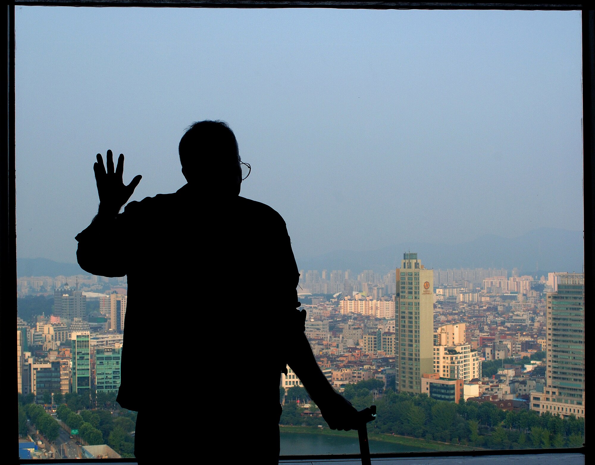 Retired Lt. Col. Harold Fischer, a fighter ace with 10 confirmed kills and the 25th registered ace, looks out over the city of Seoul, South Korea, Sept. 10. He is touring South Korea this week with fellow veterans in observance of the Air Force's 60th anniversary. (U.S. Air Force photo/Staff Sgt. Bennie J. Davis III) 
