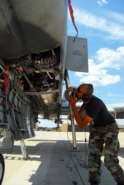 Staff Sgt. Renaldo Richardson, 23rd Aircraft Maintenance Squadron weapons load crew chief, performs a gun-system inspection on an A-10C's 30 mm cannon Sept. 6 on the Moody flightline.  The Moody-based aircraft are scheduled to begin flying missions Sept. 11.  (U.S. Air Force photo by Tech. Sgt. Parker Gyokeres)