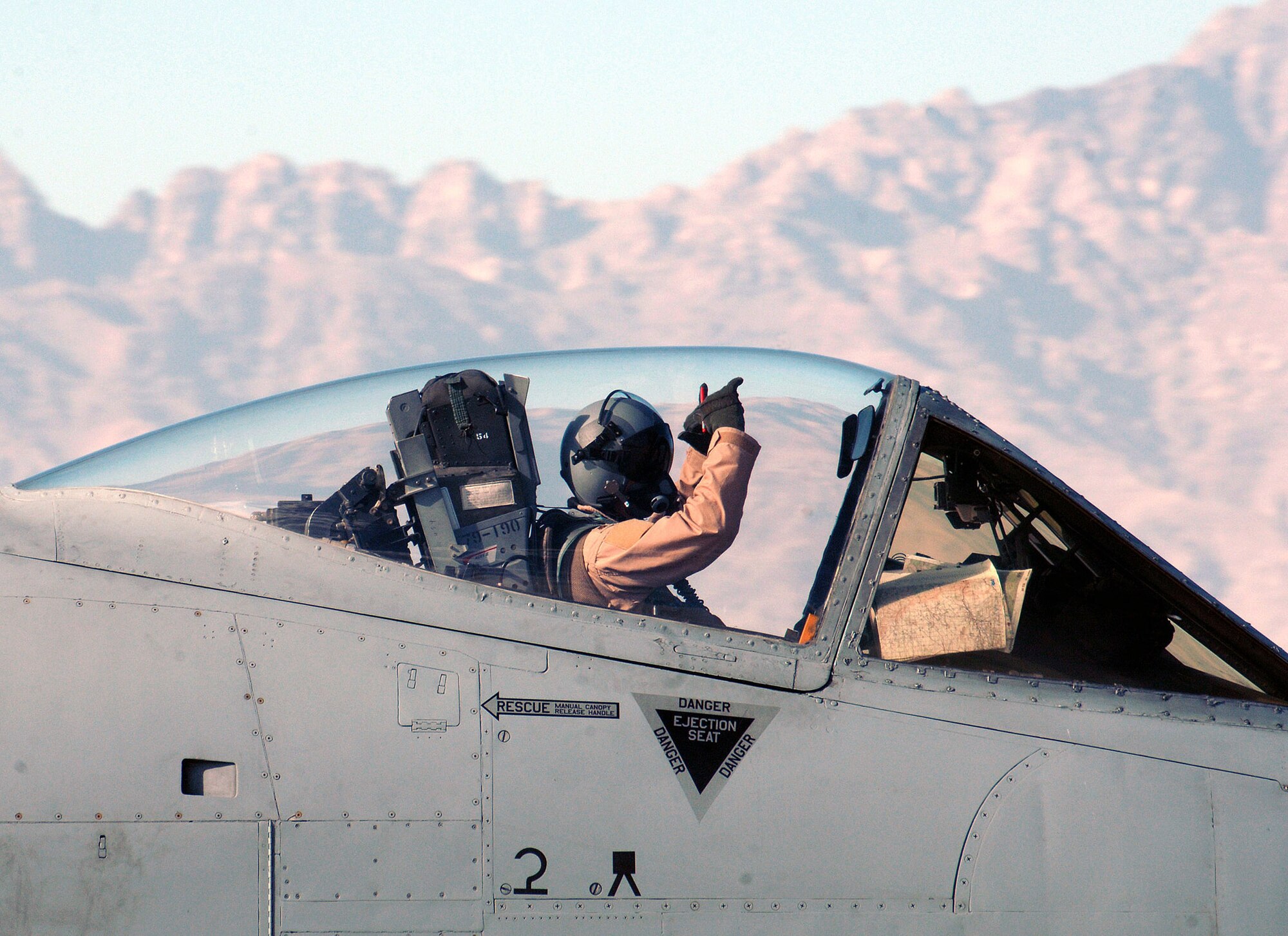 An A-10 Thunderbolt II pilot assigned to the 354th Expeditionary Fighter Squadron signals that he is "good to go" prior to a flight at Bagram Air Base, Afghanistan. Members of the 354th EFS are deployed from Davis-Monthan Air Force Base, Ariz. (U.S. Air Force photo/Staff Sgt. Craig Seals)