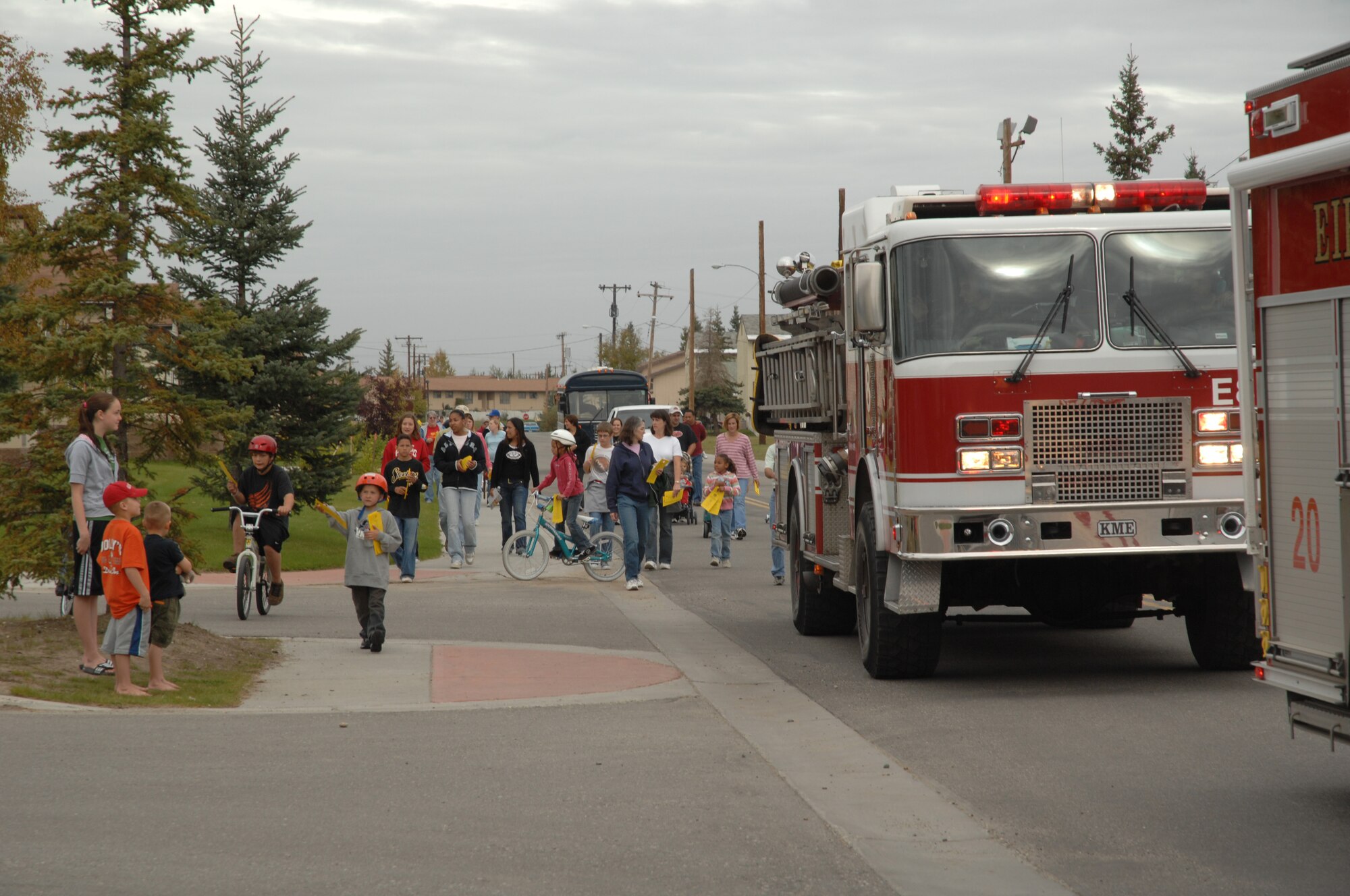 EIELSON AIR FORCE BASE, Alaska--Eielson community members walk alongside and in the chapel parade Aug. 8 through base housing. The purpose of the parade is to foster friendship and solidarity within the members of Eielson. A multi-faith rally took place after the parade ended at the Aurora Conference Center. (U.S. Air Force photo by Tech. Sgt. William Farrow)
