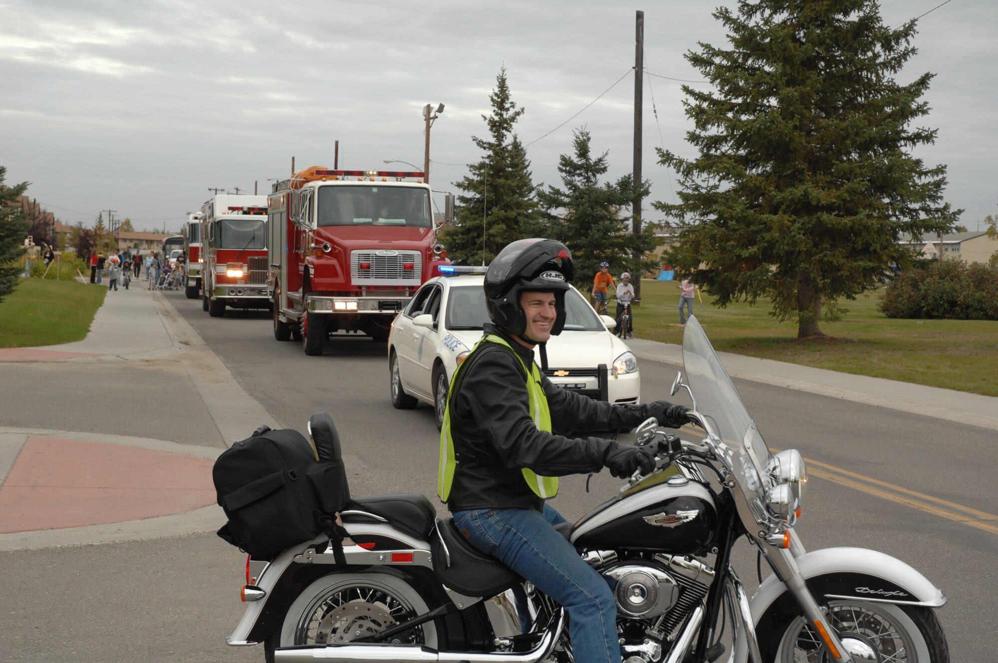 EIELSON AIR FORCE BASE, Alaska--Chap. (Capt.) Phillip Griffin, 354th Fighter Wing chapel office, leads the chapel parade through base housing on a Harley Davidson motorcycle Sept. 8. The purpose of the parade is to foster friendship and solidarity within the members of our Eielson Community. (U.S. Air Force photo by Tech. Sgt. William Farrow)