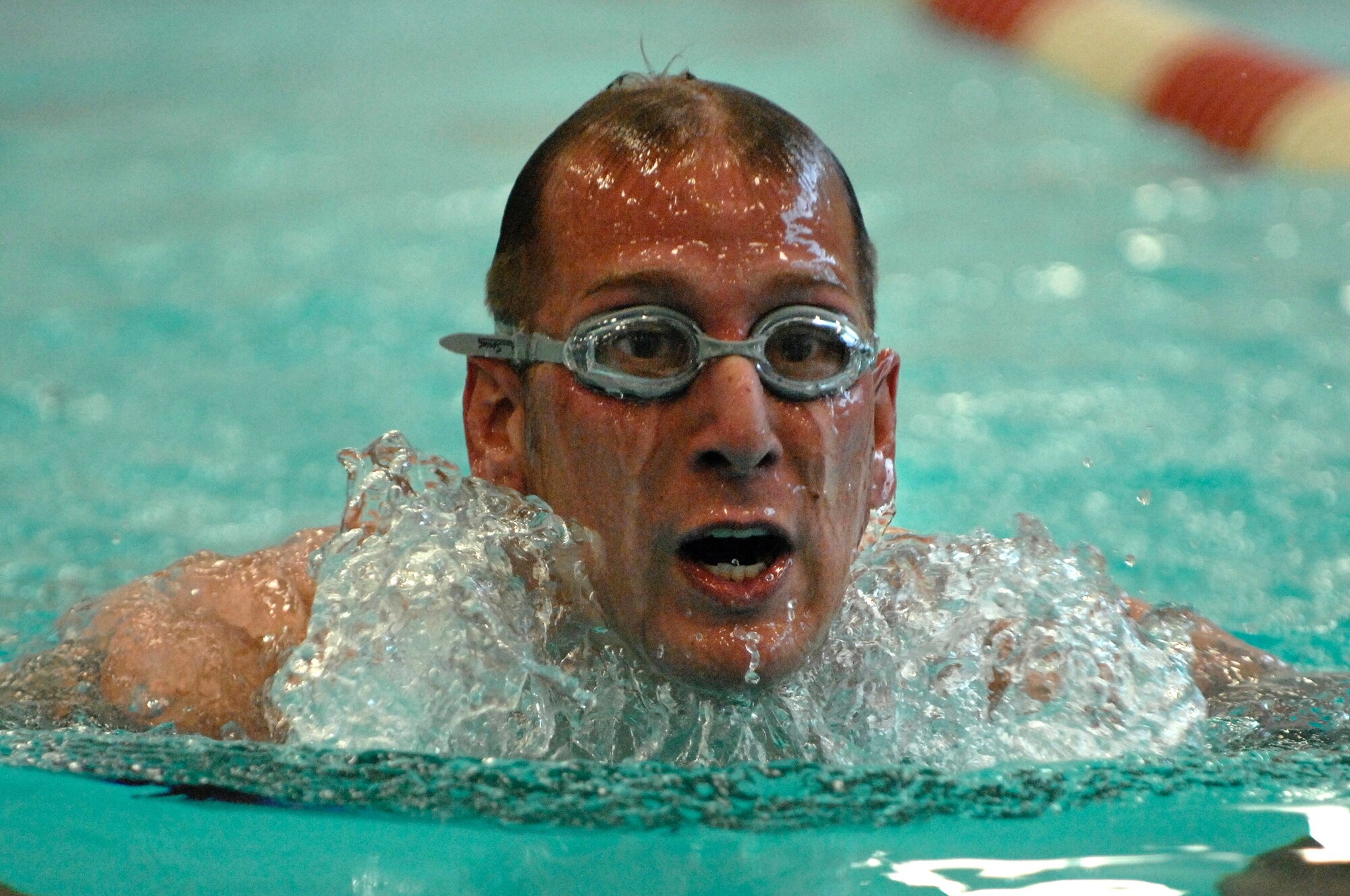 28th Bomb Wing personnel and dependents  swim during the first part of a triathlon at Ellsworth Air Force Base, S.D., Aug. 30, 2007.  The triathlon is a three part race consisting of a 1/4 mile swim, a 9 mile bike ride, and a 1 1/2 mile run.  (U.S. Air Force photo by SSgt Michael B. Keller)