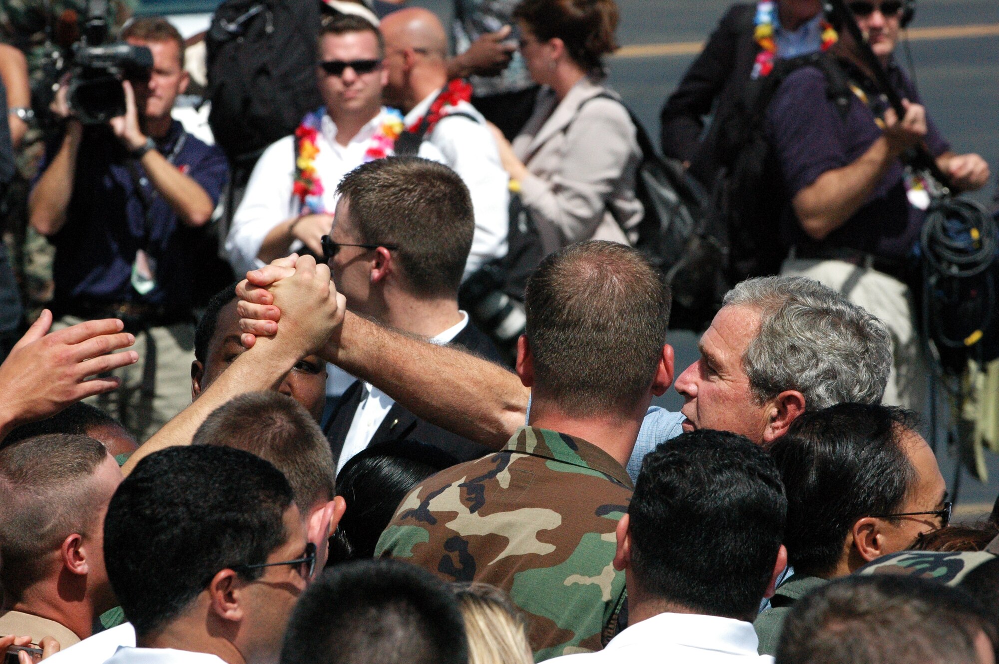 President George W. Bush greets troops during his visit to Hickam AFB, Sept. 8. Photo by 2nd Lt. Melanie McLean