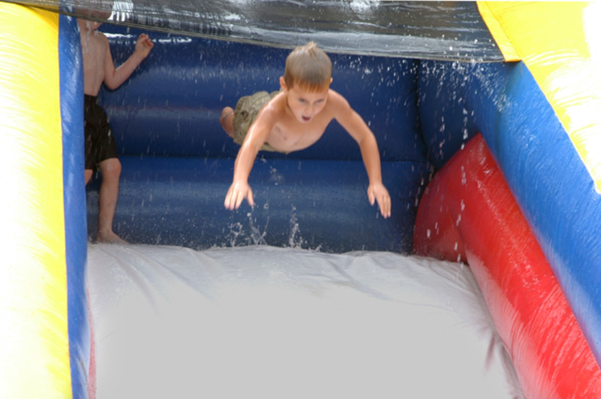 GRISSOM AIR RESERVE BASE, Ind., -- A youngster propels down the water slide at the 434th Air Refueling Wing's annual family day.  Food, games, a car show, information fair, educational activities, and art show were all part of this year's family day events. (U.S. Air Force photo/Senior Airman Carl Berry)