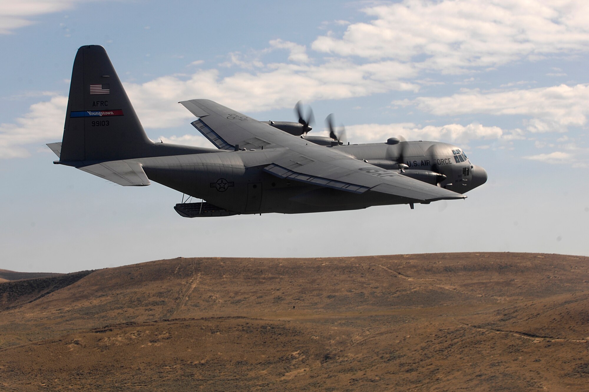 MCCHORD AIR FORCE BASE, Wash. — An Air Force Reserve C-130 Hercules from the 910th Airlift Wing, Youngstown Air Reserve Station, Ohio, competes in the air drop competition for Air Mobility Rodeo 2007 by dropping pallets on targets July 23, 2007.  Air Mobility Command's Rodeo 2007 is a readiness competition of U.S. and international mobility air forces.  It focuses on improving warfighting capabilities and support of the Global War on Terrorism.  (U.S. Air Force photo/Staff Sgt. Richard Rose)