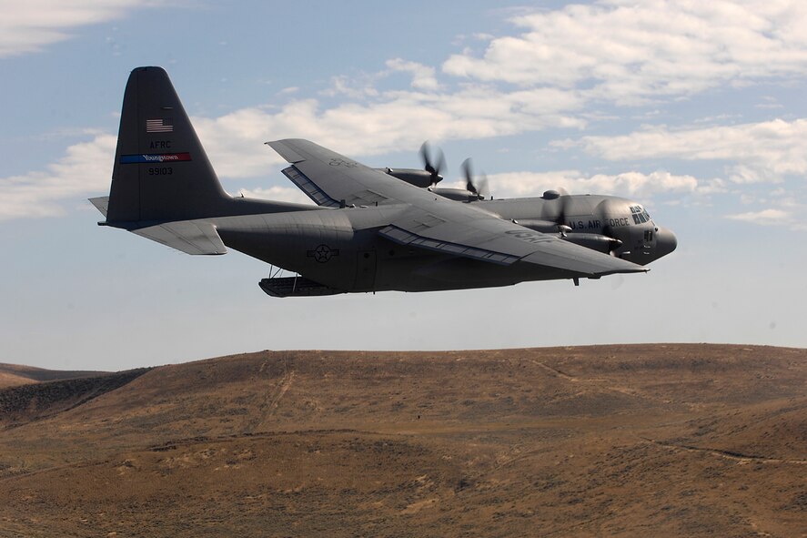 MCCHORD AIR FORCE BASE, Wash. — An Air Force Reserve C-130 Hercules from the 910th Airlift Wing, Youngstown Air Reserve Station, Ohio, competes in the air drop competition for Air Mobility Rodeo 2007 by dropping pallets on targets July 23, 2007.  Air Mobility Command's Rodeo 2007 is a readiness competition of U.S. and international mobility air forces.  It focuses on improving warfighting capabilities and support of the Global War on Terrorism.  (U.S. Air Force photo/Staff Sgt. Richard Rose)
