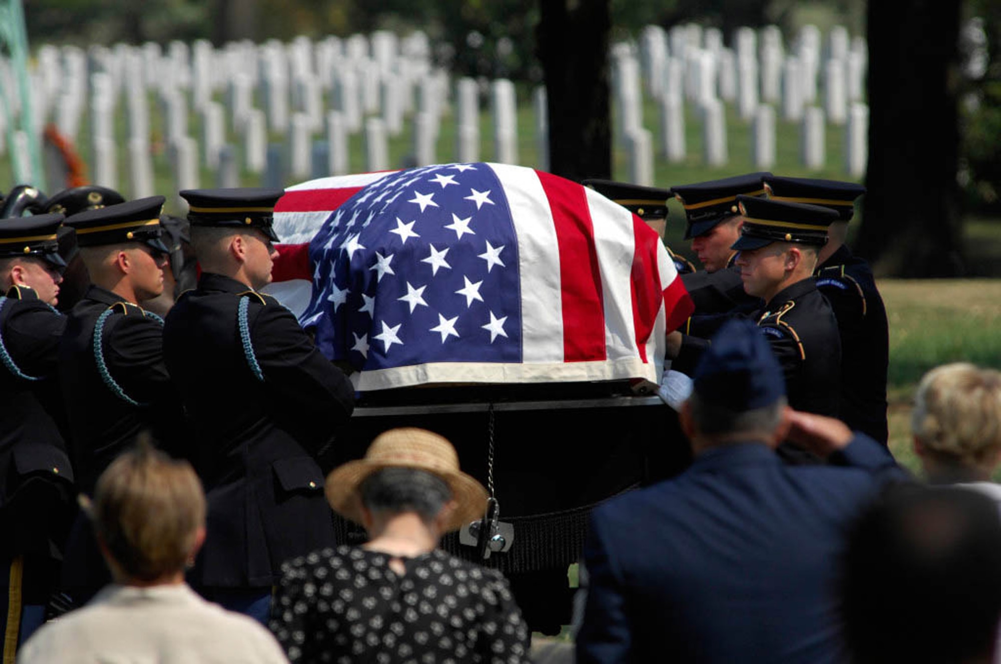 Army Color Guard members carry the casket of 2nd Lt. Harold E. Hoskin into the Fort Myer Old Post Chapel before the start of his funeral procession Sept. 7 at Arlington National Cemetery in Virginia. Lieutenant Hoskin was one of five men who were flying in a B-24 Liberator that crashed while on a test flight Dec. 21, 1943, out of Ladd Field in Fairbanks, Alaska. Lieutenant Hoskin's remains were discovered in August 2006 and identified in April 2007. (U.S. Air Force photo/Tech. Sgt. Cohen A. Young) 
