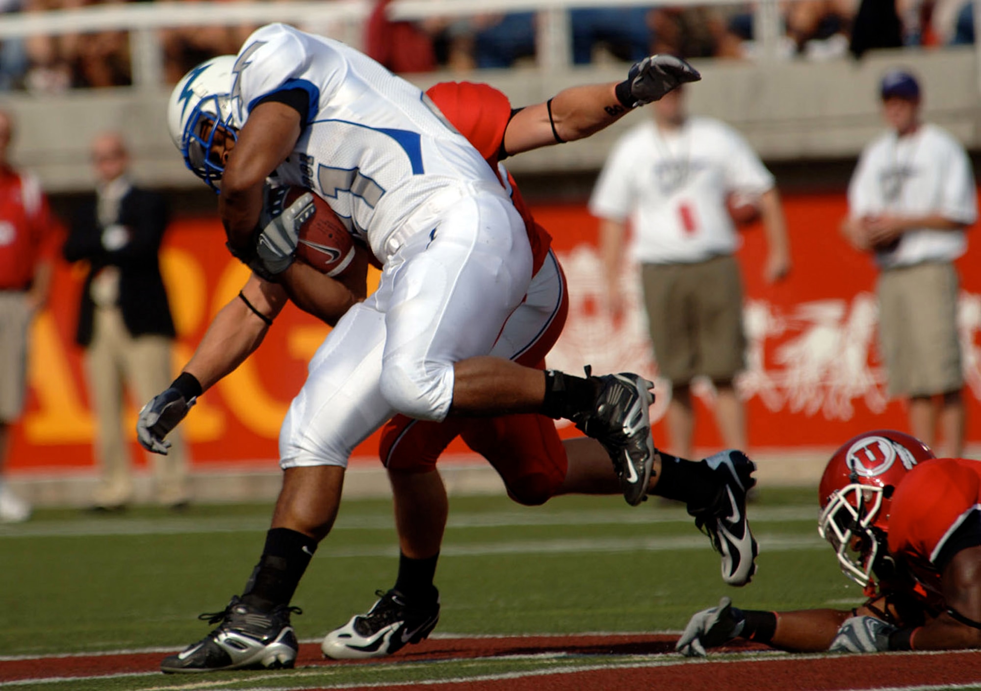 U.S. Air Force Academy Falcons senior fullback Ryan Williams charges through Utah defenders Sept. 8 in Salt Lake City. He had 13 carries for 62 yards in Air Force's 20-12 victory at Rice-Eccles Stadium. (U.S. Air Force photo/Staff Sgt. Steve Grever) 
