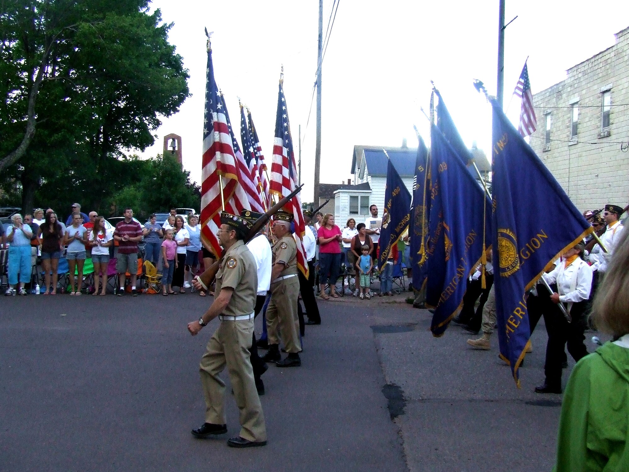 A color guard carrying the American flag starts the Independence Day parade July 4, 2007, on the main street of Bessemer, Mich.  (U.S. Air Force Photo/Tech. Sgt. Scott T. Sturkol)