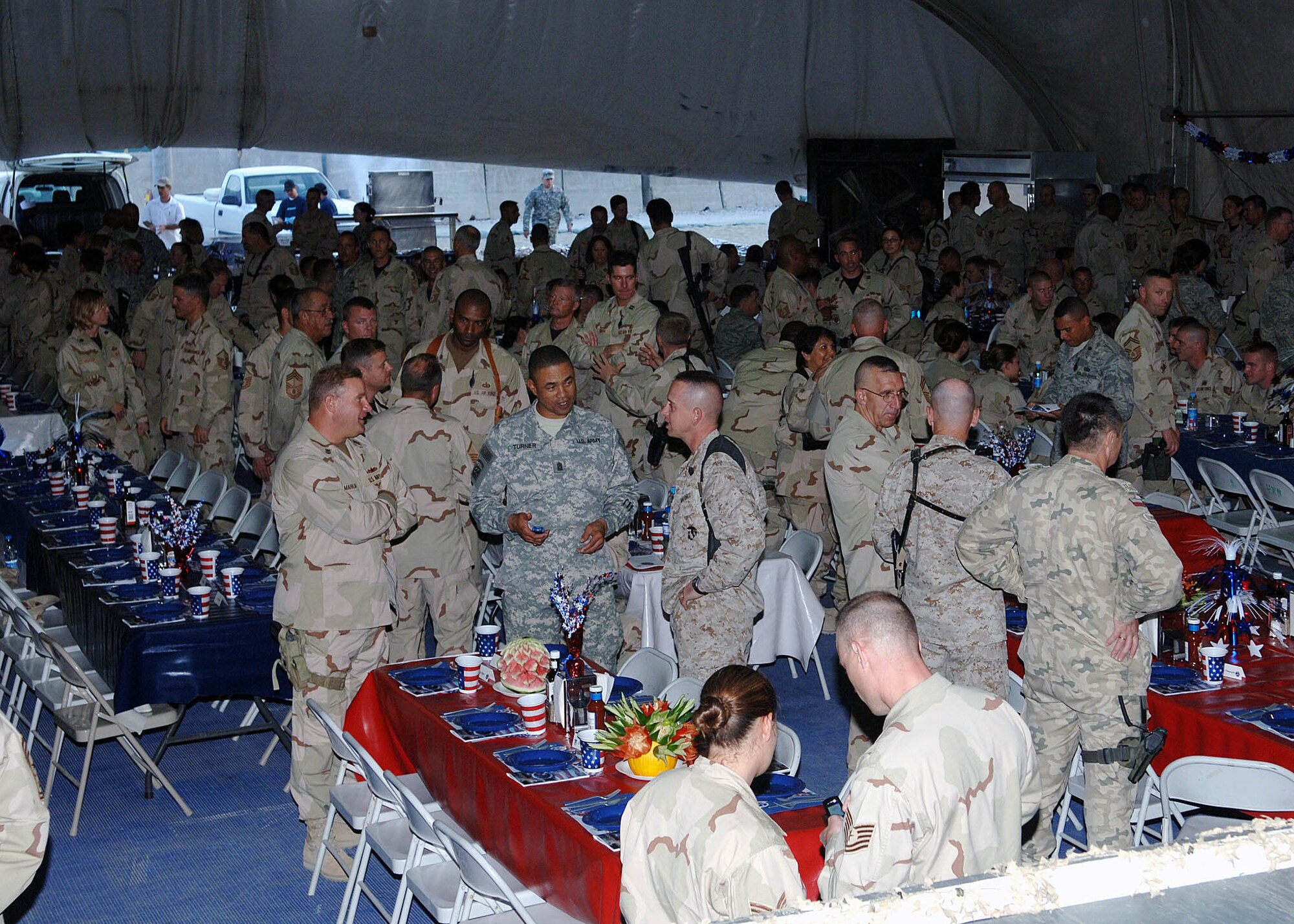 Soldiers, Sailors, Airmen and Marines were in attendance for the Air Force 60th Anniversary Ball held at Bagram Airfield, Afghanistan, September 8. The multi-service crowd enjoyed a steak and seafood dinner and videos highlighting the past, present and future roles of the Air Force. (U.S. Air Force photo by Staff Sgt. Craig Seals)