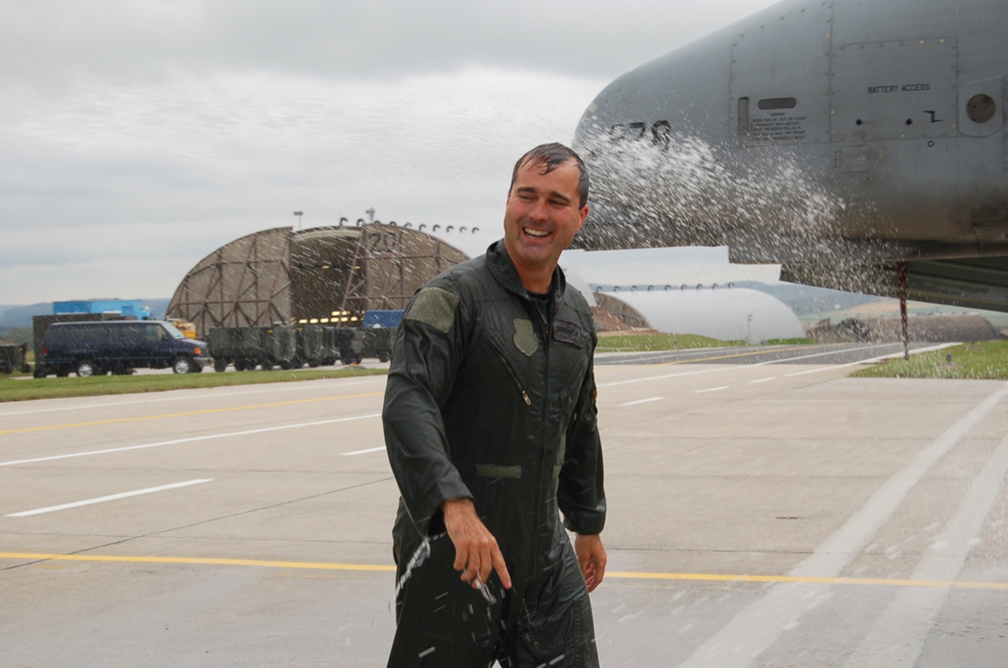 SPANGDAHLEM AIR BASE, Germany – Lt. Col. Keith McBride was on the receiving end of a fire truck hose when he landed at Spangdahlem Air Base’s runway upon his completion of 3,000 flying hours in the A/OA-10 fighter aircraft Sept. 6. Getting “watered down” is a time-honored tradition for pilots who accomplish such a milestone. Pilots who have their final flights also receive the hose. The colonel relinquished command of the 81st Fighter Squadron Sept. 7. (U.S. Air Force photo/Staff Sgt. Andrea Knudson)