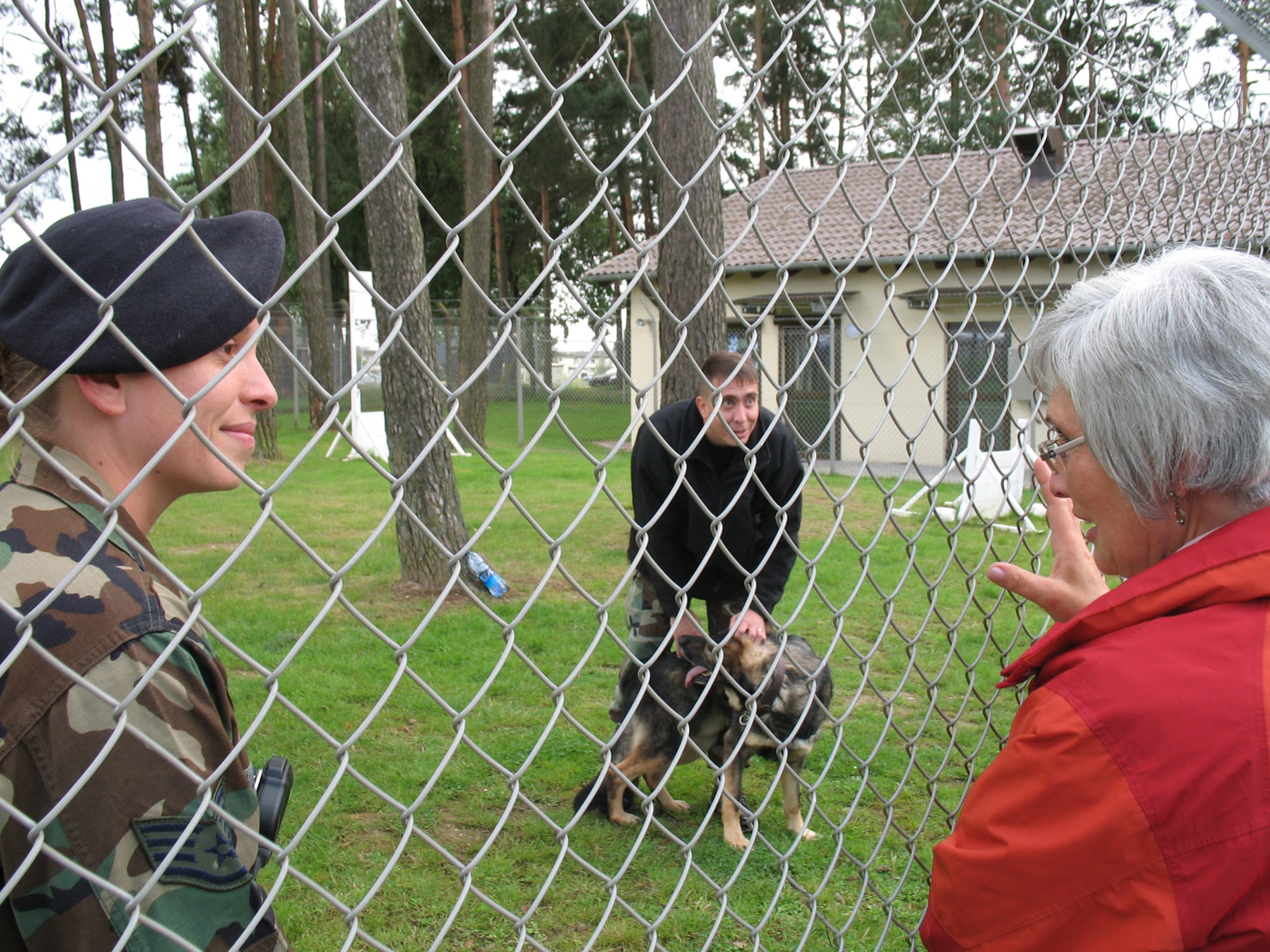 SPANGDAHLEM AIR BASE, Germany – Staff Sgt. Trica Hascall, 52nd Security Forces Squadron, talks with Marita Ortloff, Bitburg Police Station, about the military working dog program at Spangdahlem Air Base during the police station’s work outing Sept. 4, 2007. (U.S. Air Force photo/ Simone Chapman)