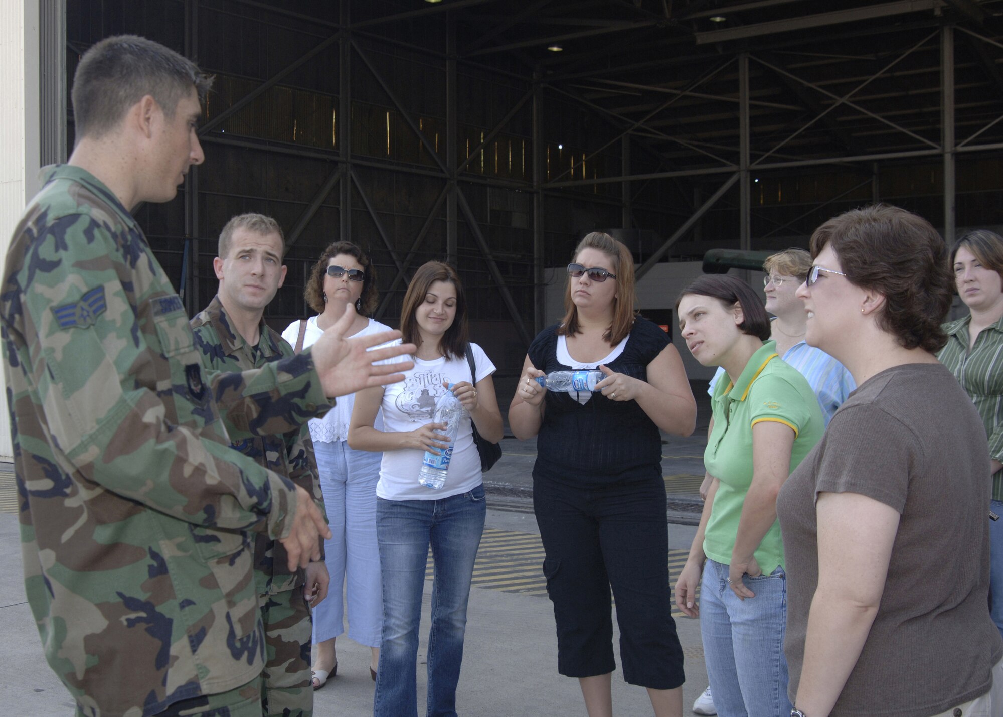 Senior Airman Zach Sommers, 39th Maintenance Squadron, briefs spouses of 39th MXS Airmen during a spouses' tour Aug. 30. The tour lasted all morning and ended with a picnic at Arkadas Park for the 39th MXS and their families. (U.S. Air Force photo by Senior Airman Tiffany Colburn)(RELEASED)