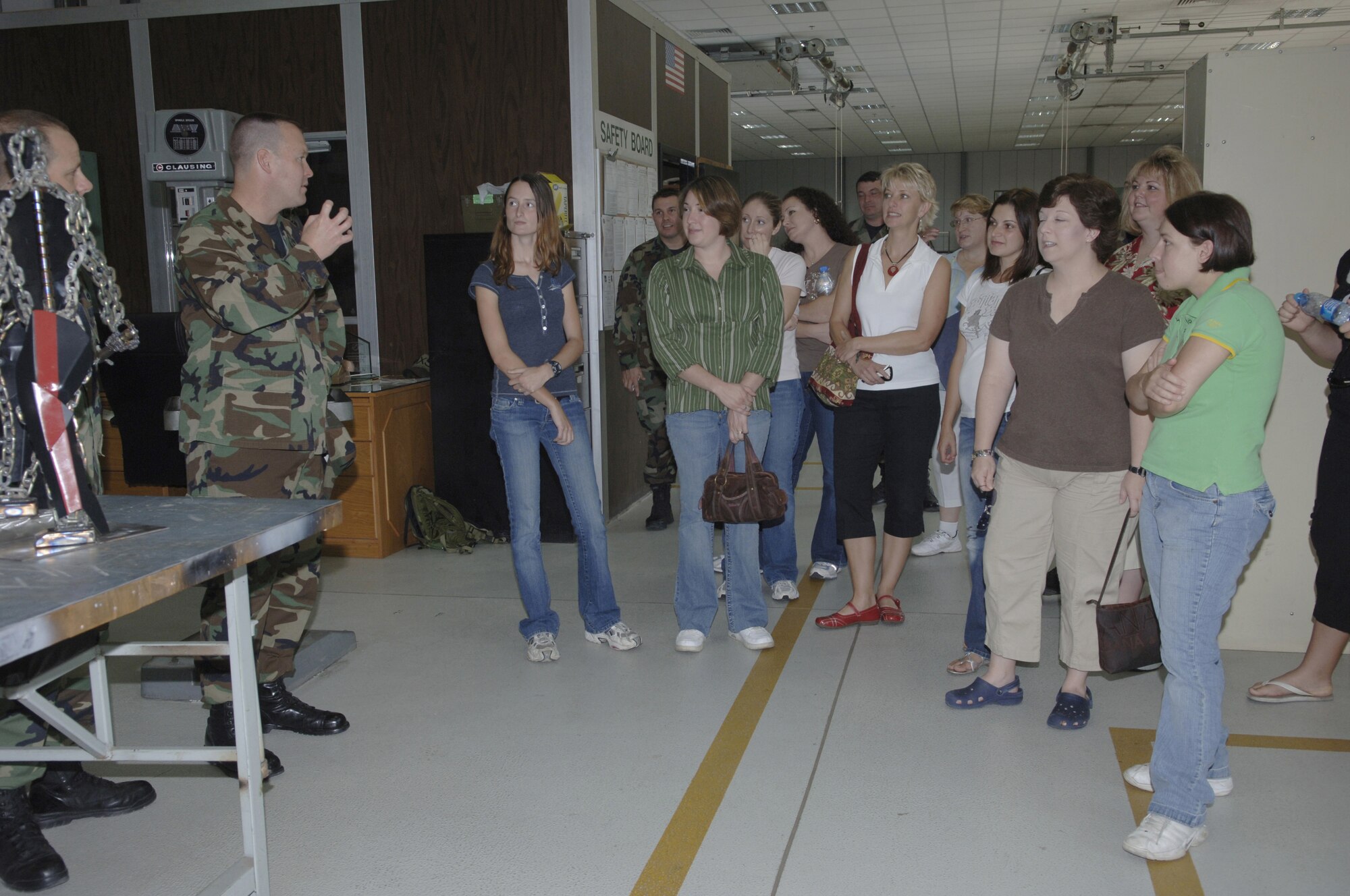 Maj. Kenneth Speidel, 39th Maintenance Squadron commander, speaks to spouses of 39th MXS Airmen during a briefing on a spouses' tour Aug. 30. The tour allowed the spouses to learn about their husbands' jobs and ask questions about the mission. (U.S. Air Force photo by Senior Airman Tiffany Colburn)(RELEASED)