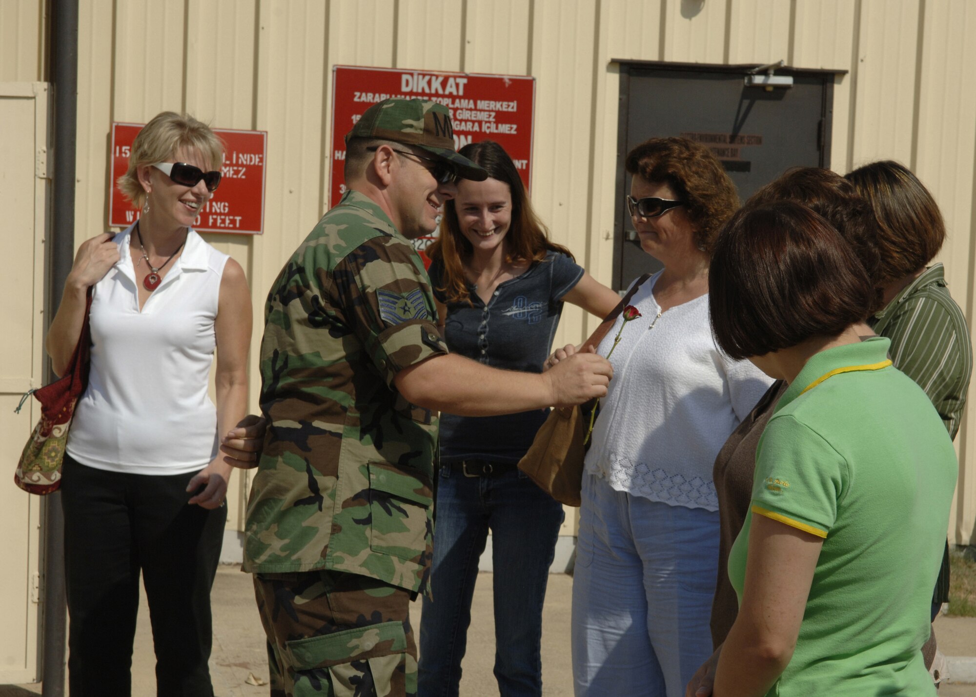 Tech. Sgt. Michael Maynard, 39th Maintenance Squadron, shows spouses of 39th MXS Airmen a rose that was frozen in liquid oxygen as part of a demonstration during a spouse’s tour Aug. 30. The twelve spouses that participated were able to ask various questions throughout the briefings. (U.S. Air Force photo by Senior Airman Tiffany Colburn)(RELEASED)