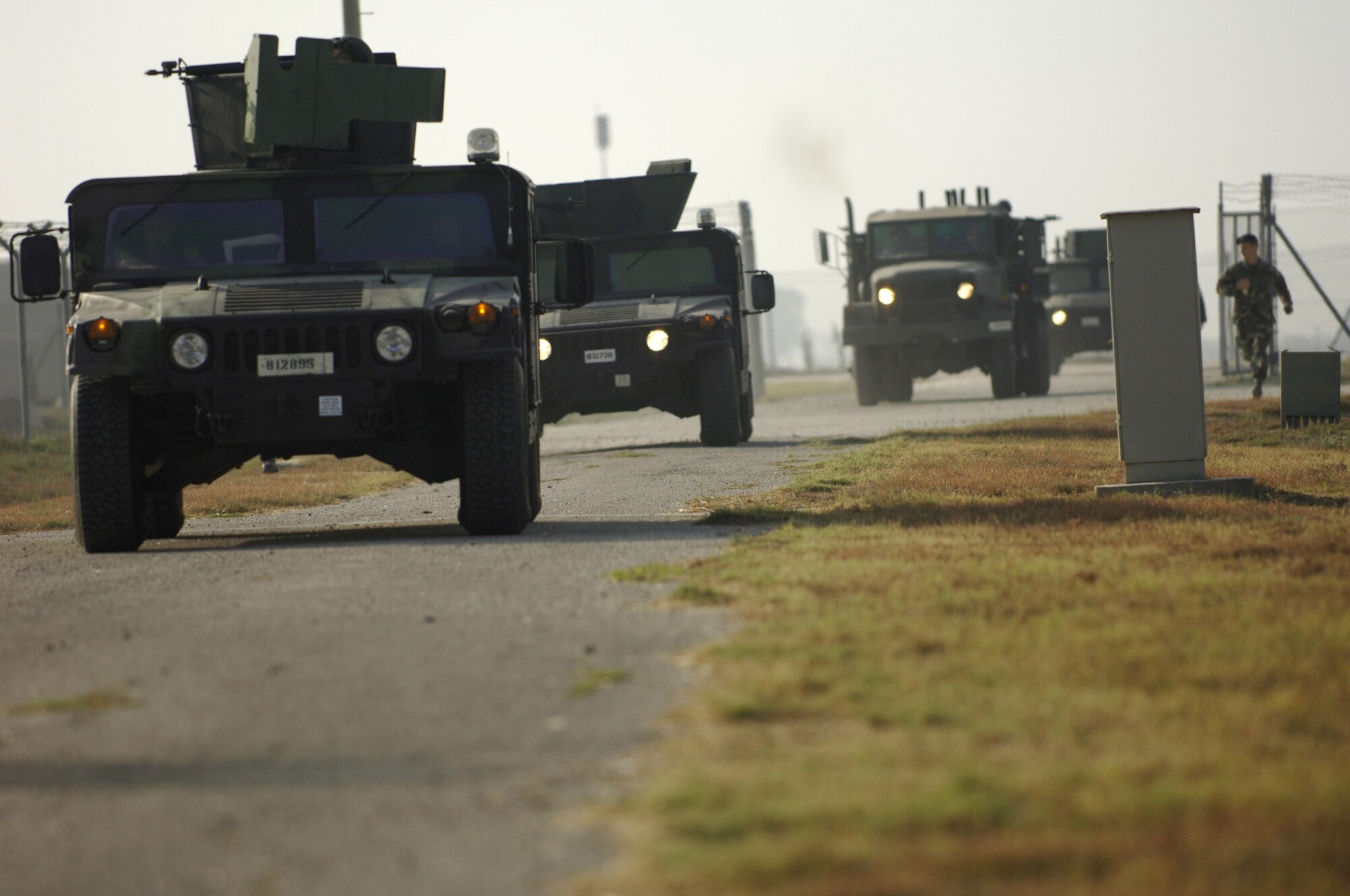 Airmen of Team Incirlik's convoy training plow through small arms fire in route to their final destination during Incirlik's first hands on convoy training class Aug. 31. Incirlik's convoy training program prepares Airmen to defend against real world threats in deployed locations. (U. S. Air Force photo by Airman 1st Class Nathan Lipscomb)(RELEASED)