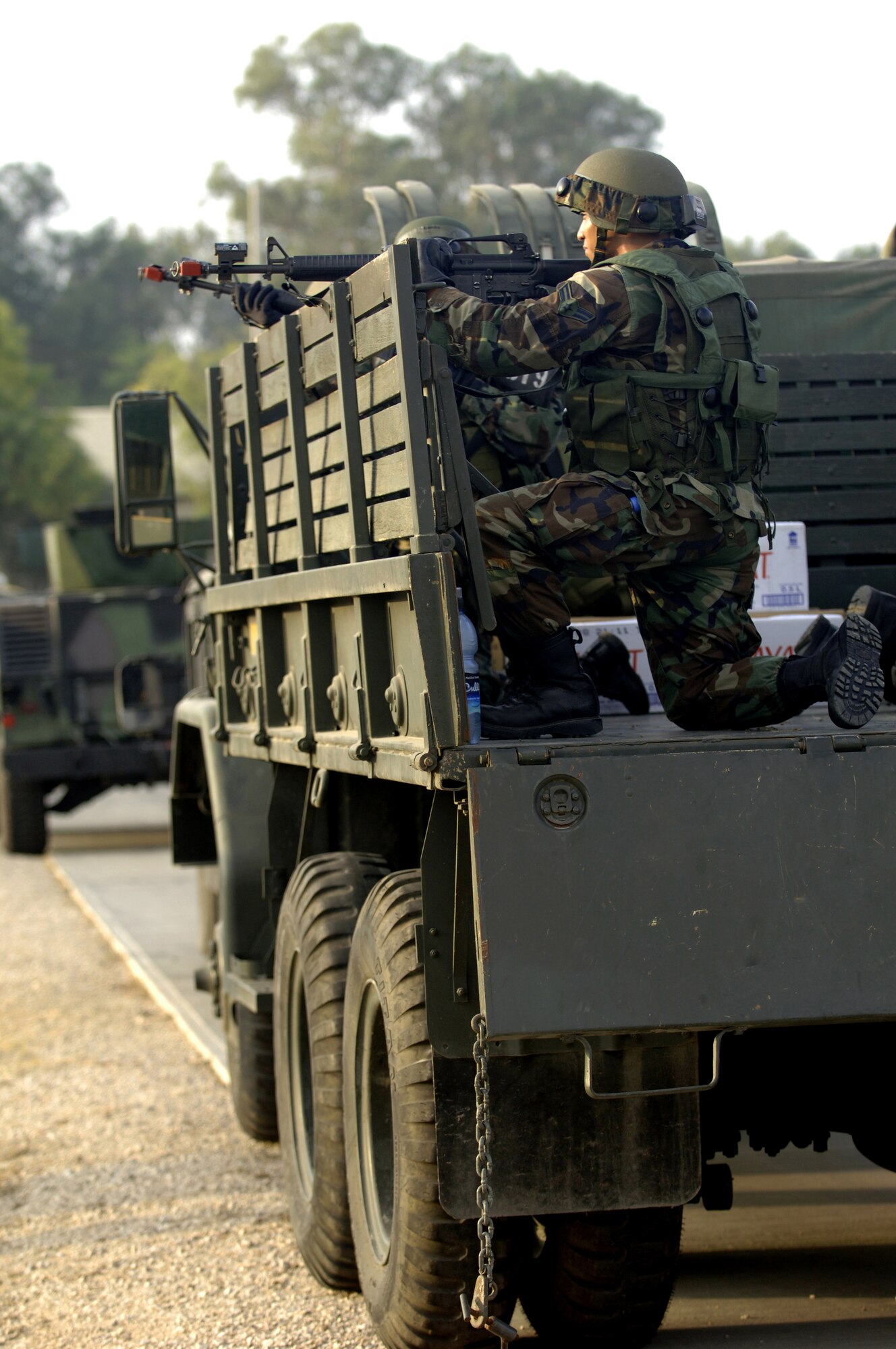 Tech Sgt. Gabriel Grasso, 39th Logistics Readiness Squadron, uses a Humvee for cover while returning fire at opposing forces during an Air Expeditionary Force training exercise for future deployments Aug. 31. This is the first time Incirlik has had the training allowing Airmen to get out in the field and practice what they have learned for upcoming deployments. (U.S. Air Force photo by Senior Airman Tiffany Colburn)(RELEASED)