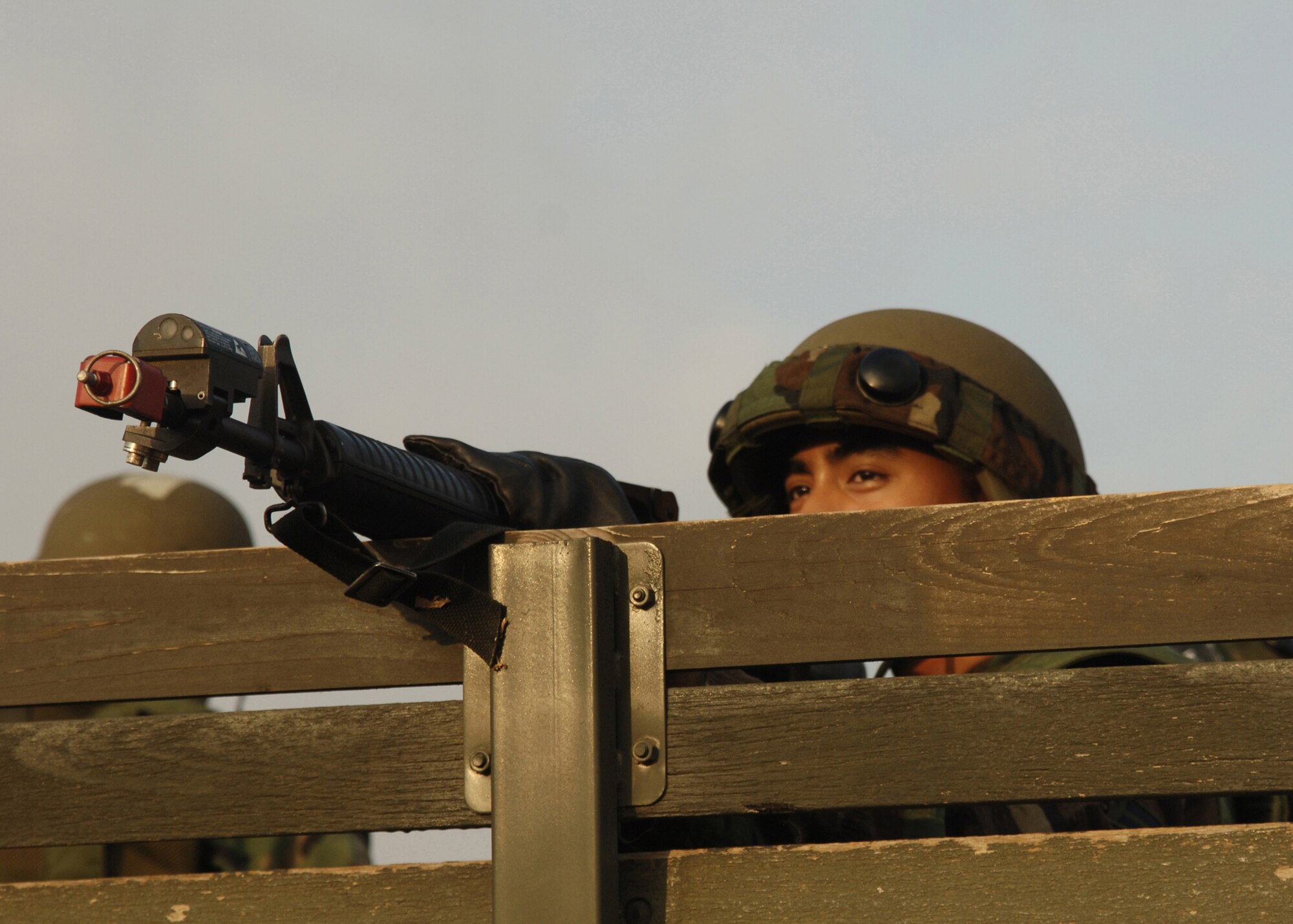 Airman 1st Class Anthony Cayetano 39th Communications Squadron, keeps watch while practicing a scenario for an Air Expeditionary Force training exercise Aug. 31. The Airmen learned different skills and techniques, and during the last day of training they were taken out to the field to practice what they had learned.  (U.S. Air Force photo by Senior Airman Tiffany Colburn)(RELEASED)