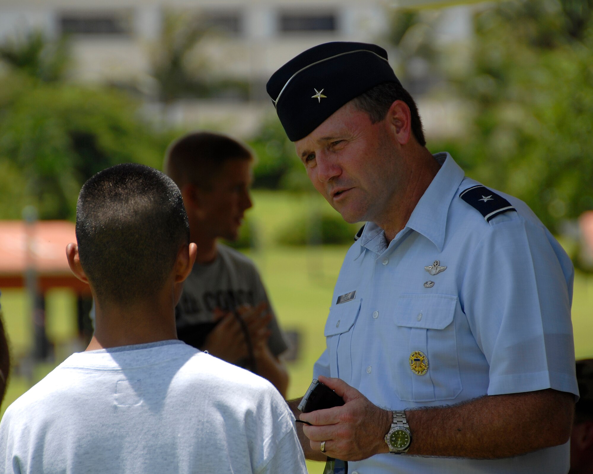 ANDERSEN AIR FORCE BASE GUAM, Brig. Gen. Douglas Owens, 36th Wing commander, answers questions about the Air Force and its 60 year history during the Air Force demonstration Sept. 8 at Ypao Beach Park. (U.S. Air Force Photo by Airman First Class Daniel Owen)