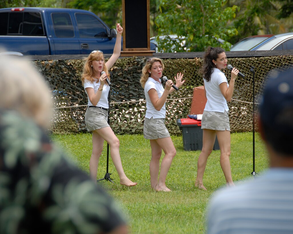 ANDERSEN AIR FORCE BASE GUAM, The American Belles perform in front of a mixed crowd of civilians and service members to celebrate the Air Force's 60th Anniversary celebration. Andersen Airmen conducted many Air Force exhibitions on Guam's Ypao Beach.(U.S. Air Force Photo by Airman First Class Daniel Owen)