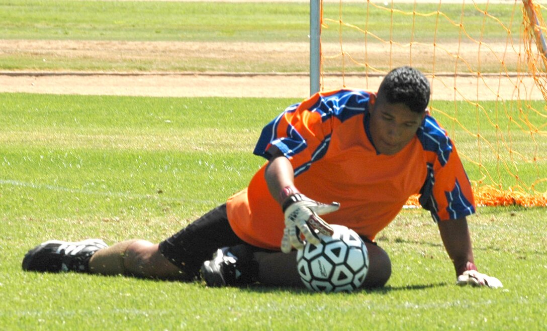 Lance Cpl. Jose Villanueva, Support Bn., blocks 12th Marine Corps District from scoring a goal. The two teams played a close game and 12th MCD took the victory with the ending score of 4-2.