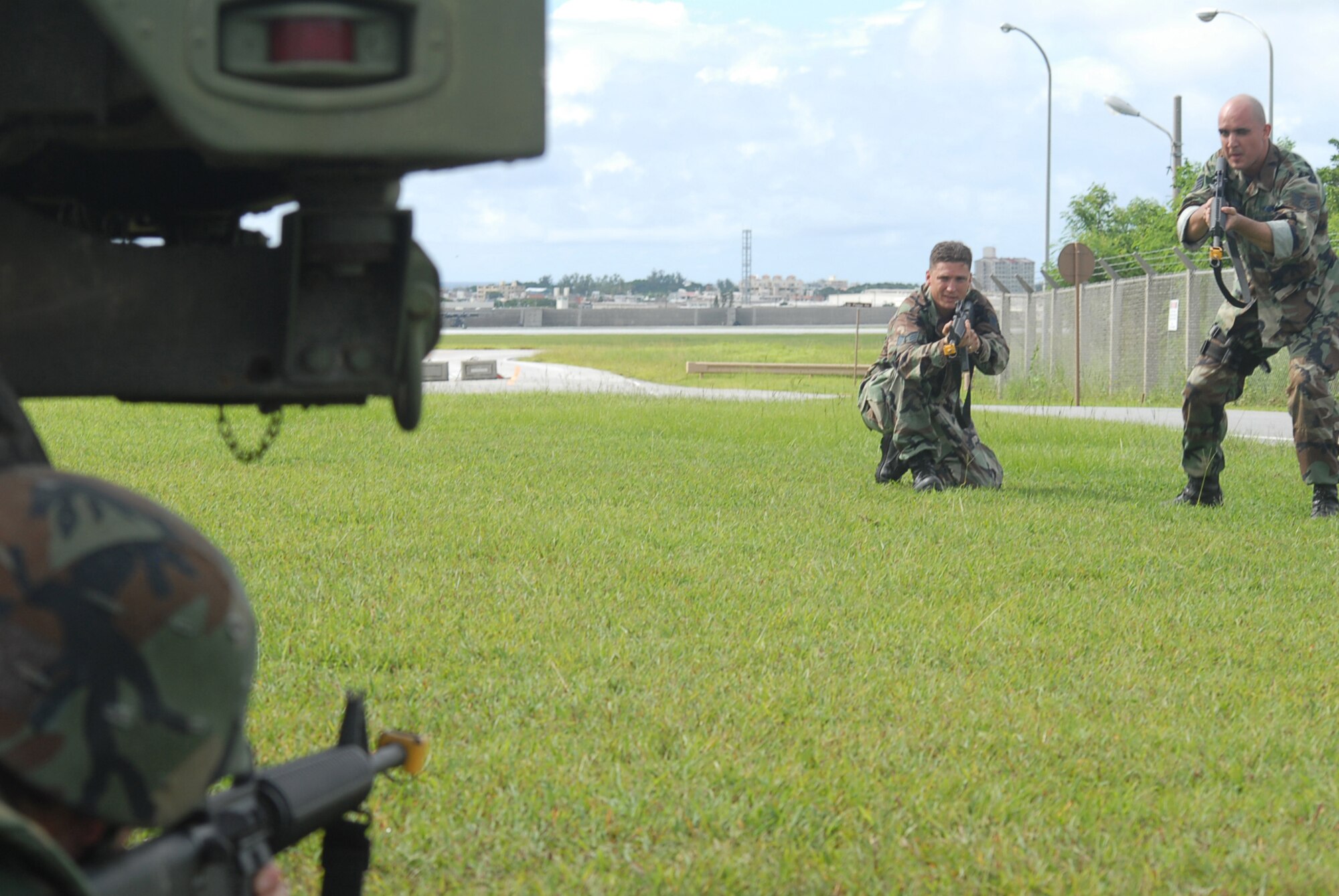 Staff Sgts. Austin Pullins (left) and Julio Garcia act as aggressors during a convoy stoppage exercise during the Expeditionary Combat Skills Training at Kadena Air Base, Japan, Sept. 11, 2007. This course teaches the basic tools needed for surviving in the combat zone. Both Sergeants are 18th Wing Group ECST instructors.  Sergeant Pullins is assigned to the 18th Communications Squadron and Sergeant Garcia is assigned to the 390th Intelligence Squadron. (U.S. Air Force Photo/Senior Airman Darnell T. Cannady)