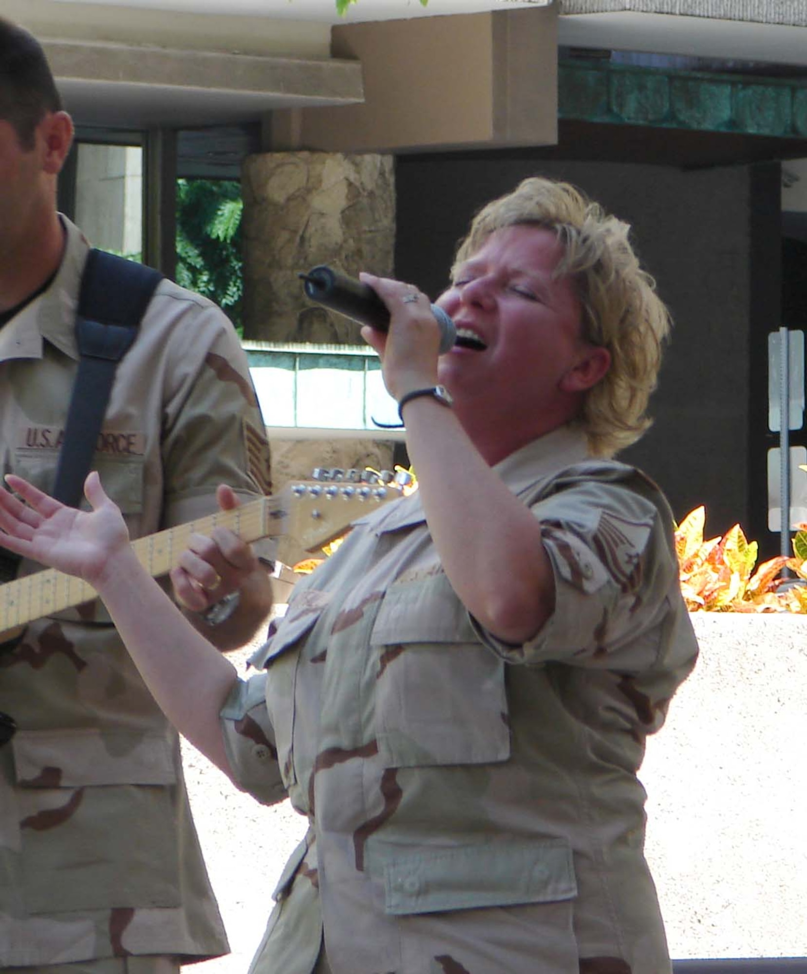 Master Sgt. Judy Westfall performs patriotic music at a ceremony held at Tamirand Park commemorating Sept. 11.  “Members of our armed forces continue to do what they can to keep our nation free. Today is a day to remember and never forget and continue our efforts towards world peace “Mufi Hannemann, Mayor of the City and County of Honolulu. (U.S. Air Force photo/Capt. Allison Farabaugh)