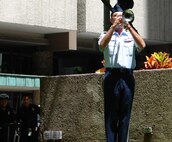 Master Sgt. David Jenkins, a member of the Pacific Air Forces Band - Hawaii,  plays taps during a Sept. 11 rememberance ceremony.  The Mayor's ceremony was held at Tamirand Park, Honolulu Hawaii.  “Members of our armed forces continue to do what they can to keep our nation free. Today is a day to remember and never forget and continue our efforts towards world peace “ Mufi Hannemann, Mayor of the City and County of Honolulu.  (U.S. Air Force photo/Capt. Allison Farabaugh)
